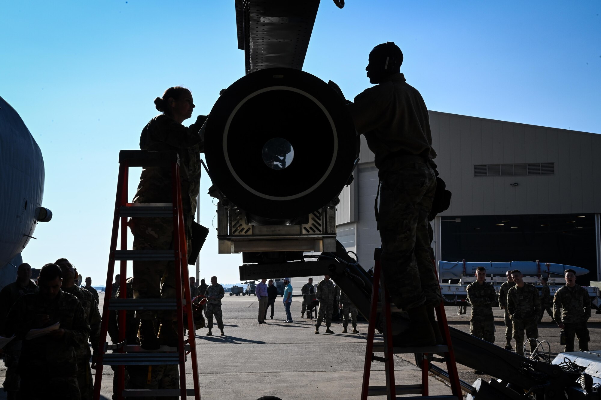 U.S. Air Force Master Sgt. Marcella Philips, 2nd Maintenance Group weapons standardization loading standardization crew chief, and Tech Sgt. Darrell Stewart, 307th Aircraft Maintenance Squadron loading standardization crew member, secure the Air-Launched Rapid Response Weapon to the B-52H Stratofortress ejector rack, at Barksdale Air Force Base, Louisiana, November 2, 2022.