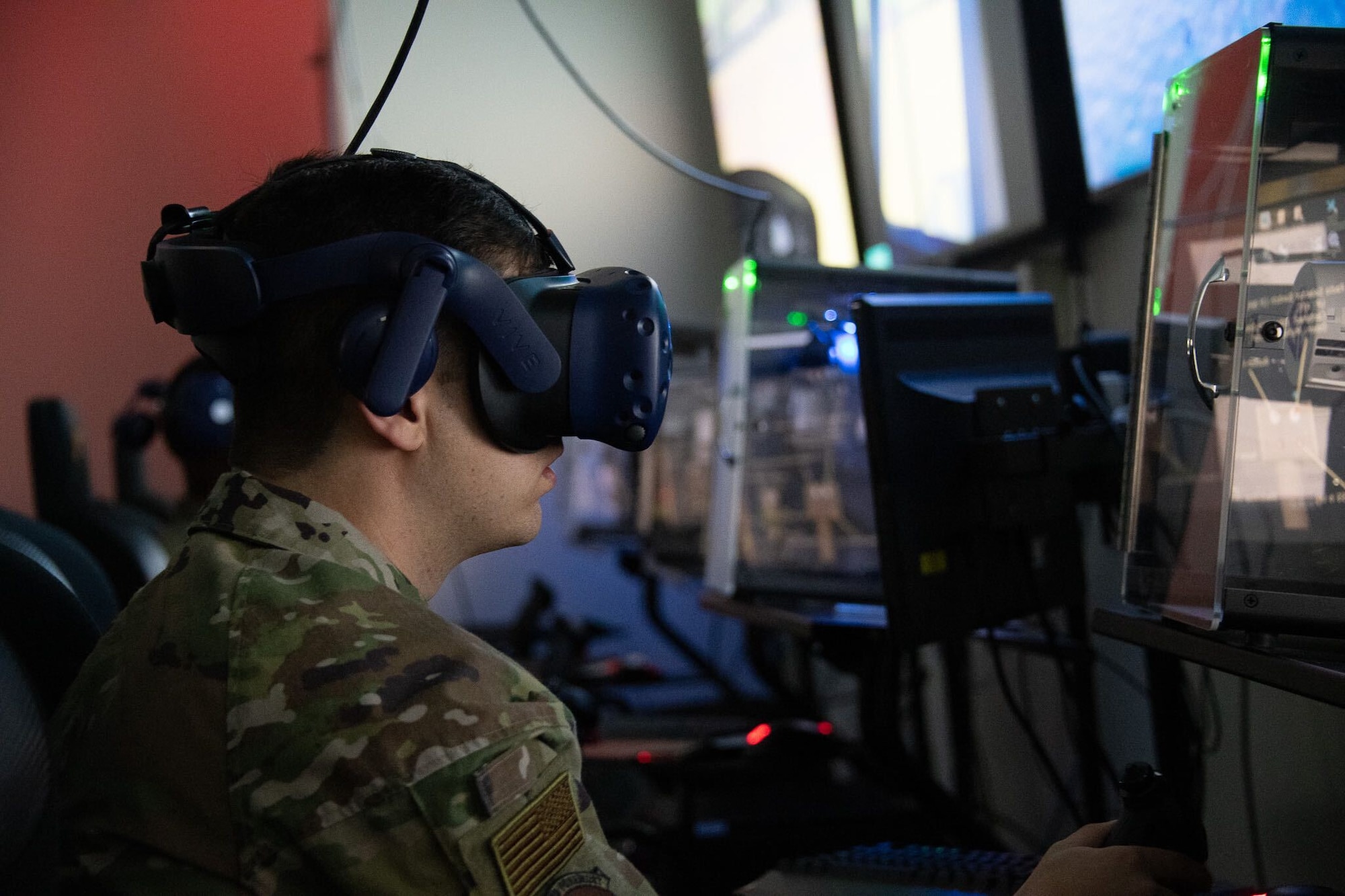 Man in uniform uses virtual reality simulator