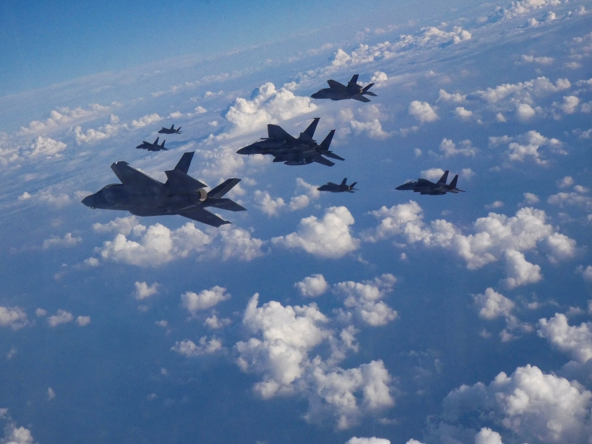U.S. Air Force F-15E Strike Eagles and Israeli Air Force F-35 Lightening II fly in formation as part of a bilateral exercise in the U.S. Central Command area of responsibility, Nov. 29, 2022. (U.S. Air Force courtesy photo)