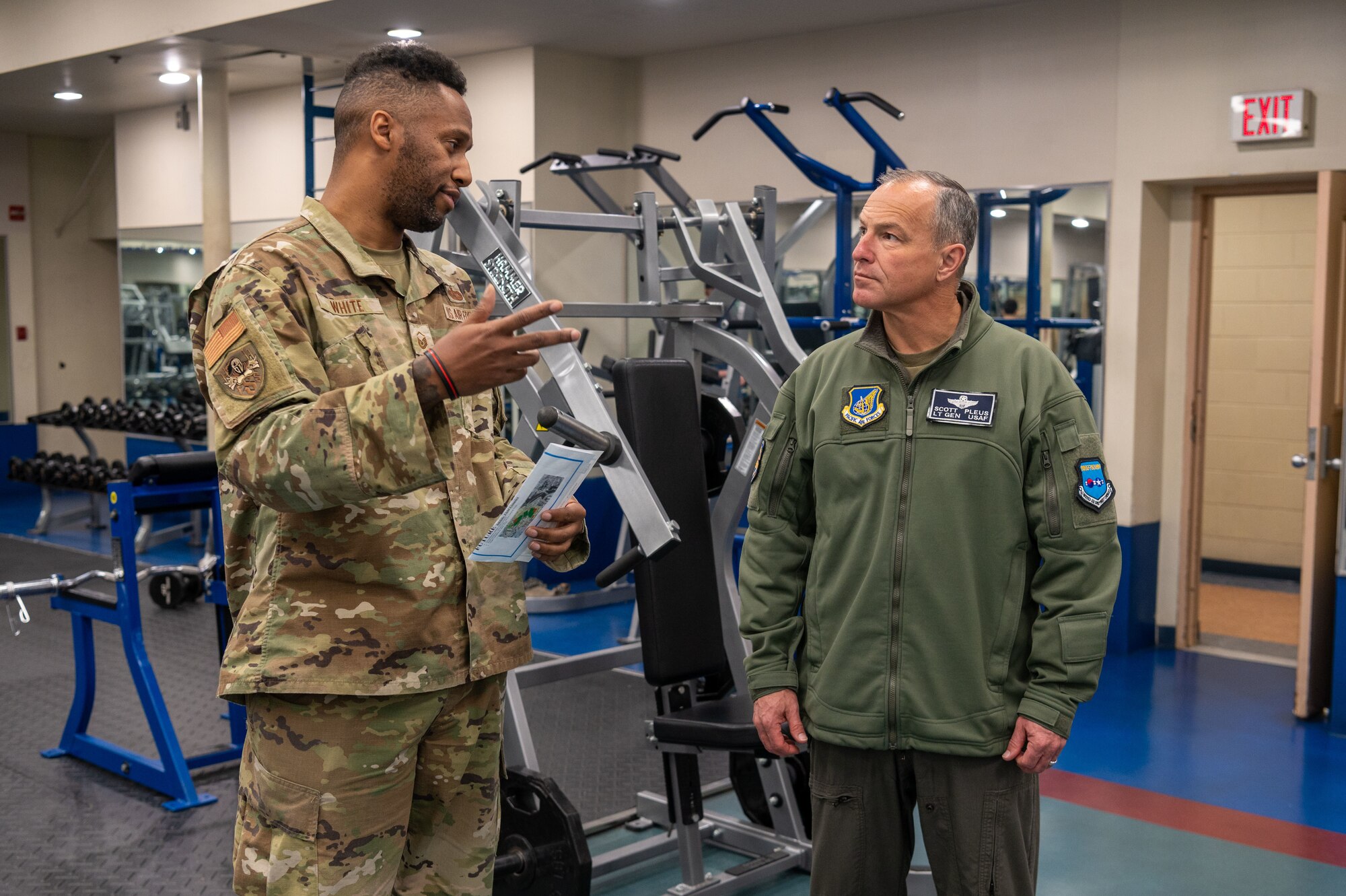 U.S. Air Force Master Sgt. Jeffrey White, 51st Force Support Squadron fitness section chief, gives Lt. Gen. Scott Pleus, 7th Air Force commander a tour of the fitness center at Osan Air Base, Republic of Korea, Nov. 30, 2022.