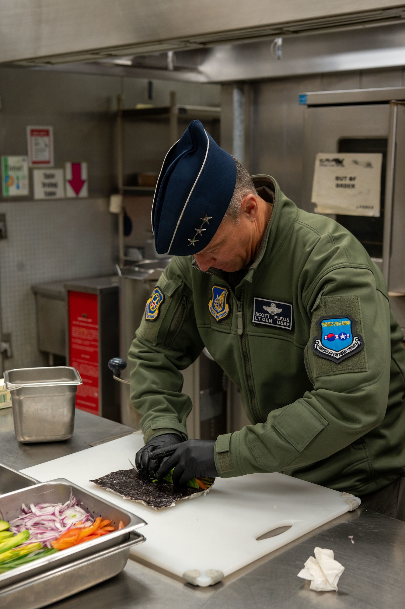 U.S. Air Force Lt. Gen. Scott Pleus, 7th Air Force commander, rolls sushi at the Gingko Tree dining facility on Osan Air Base, Republic of Korea, Nov 30. 2022.