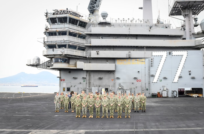 Vice Adm. Thomas Ishee, right, commander, U.S. Sixth Fleet and commander, Naval Striking and Support Forces NATO, discusses leadership and maritime warfighting with U.S. Navy leadership during the Commander, Task Force (CTF) Commanders Conference aboard the Nimitz-class aircraft carrier USS George H.W. Bush (CVN 77) in Naples, Italy, Nov. 30, 2022.