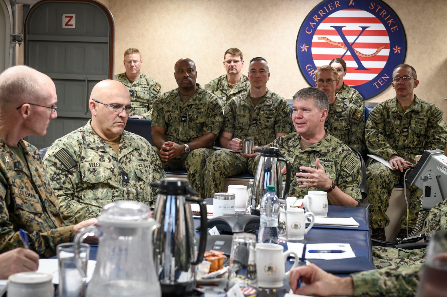 Vice Adm. Thomas Ishee, right, commander, U.S. Sixth Fleet and commander, Naval Striking and Support Forces NATO, discusses leadership and maritime warfighting with U.S. Navy leadership during the Commander, Task Force (CTF) Commanders Conference aboard the Nimitz-class aircraft carrier USS George H.W. Bush (CVN 77) in Naples, Italy, Nov. 30, 2022.