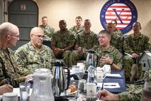 Vice Adm. Thomas Ishee, right, commander, U.S. Sixth Fleet and commander, Naval Striking and Support Forces NATO, discusses leadership and maritime warfighting with U.S. Navy leadership during the Commander, Task Force (CTF) Commanders Conference aboard the Nimitz-class aircraft carrier USS George H.W. Bush (CVN 77) in Naples, Italy, Nov. 30, 2022.