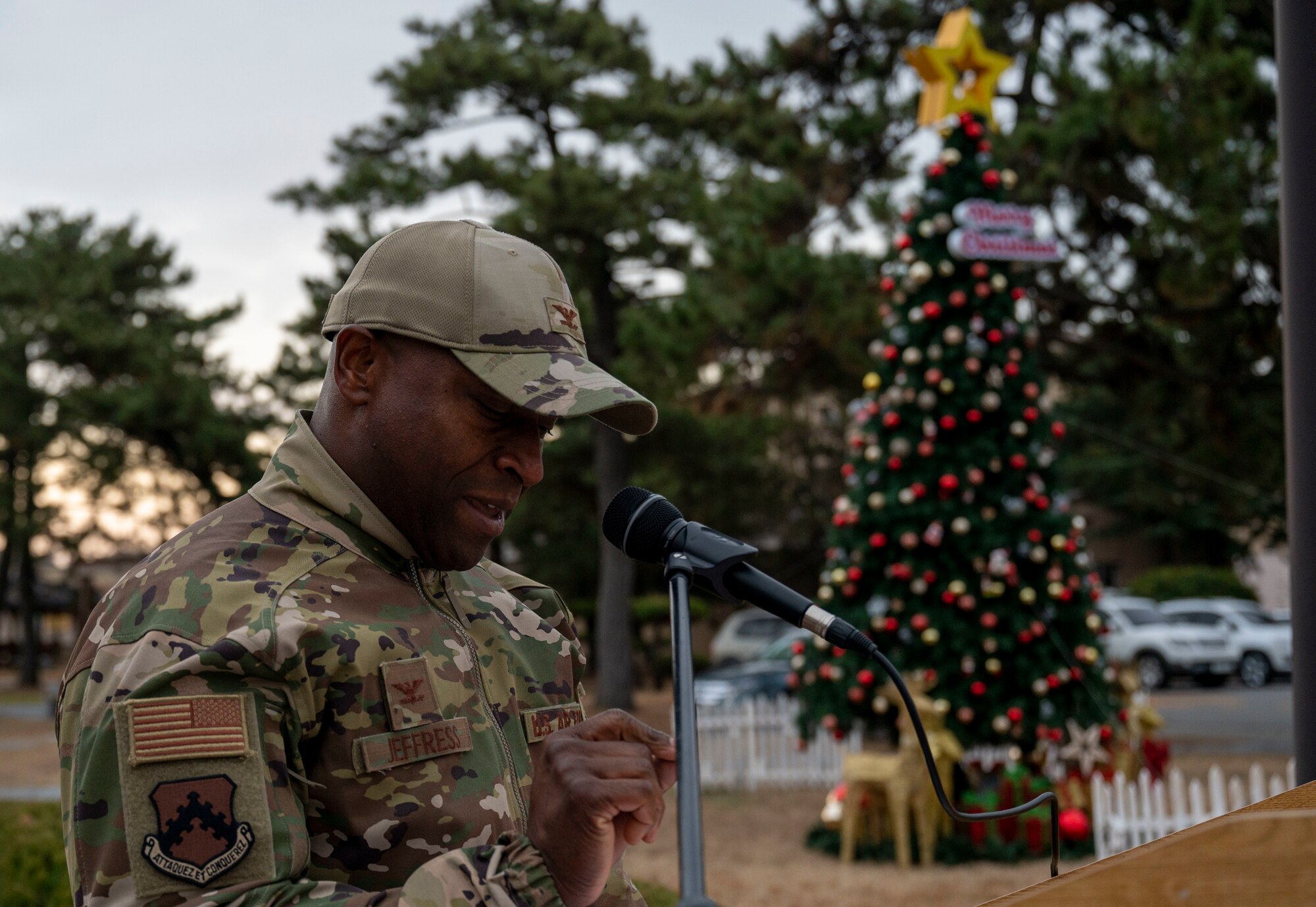 U.S. Air Force Col. Henry R. Jeffress, III, 8th Fighter Wing commander provides opening remarks at the tree lighting ceremony at Kunsan Air Base, Republic of Korea, Dec. 1, 2022. It is tradition to have the wing commander provide opening remarks and assist with the lighting of the base’s holiday tree. (U.S. Air Force photo by Tech. Sgt. Timothy Dischinat)