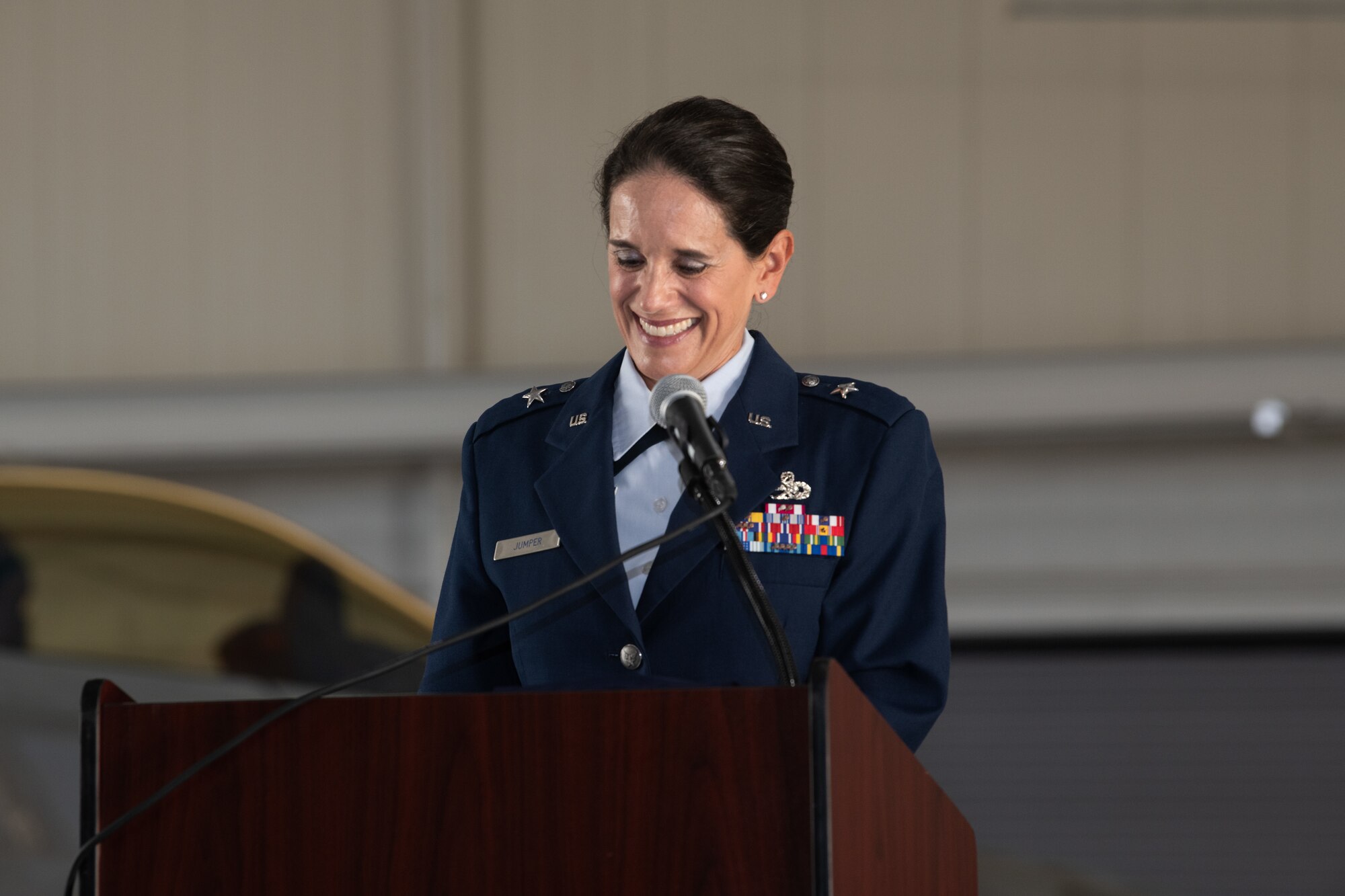 Brig. Gen. Catherine M. Jumper is standing at a podium smiling.