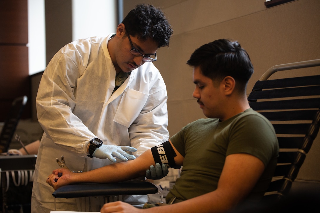 U.S. Marines with FMFLANT, MARFORCOM, MARFOR NORTHCOM, gets his vitals checked during an ASBP blood drive at Naval Support Activity Hampton Roads, Virginia, Nov. 30, 2022. The U.S. Marines with FMFLANT, MARFORCOM, MARFOR NORTHCOM volunteered for the ASBP quarterly blood drive in order to contribute to a greater cause. The ASBP is a joint operation that collects, tests, stores, transports and distributes blood products to needed military locations around the world. (U.S. Marine Corps photo by Lance Cpl. Angel Alvarado)