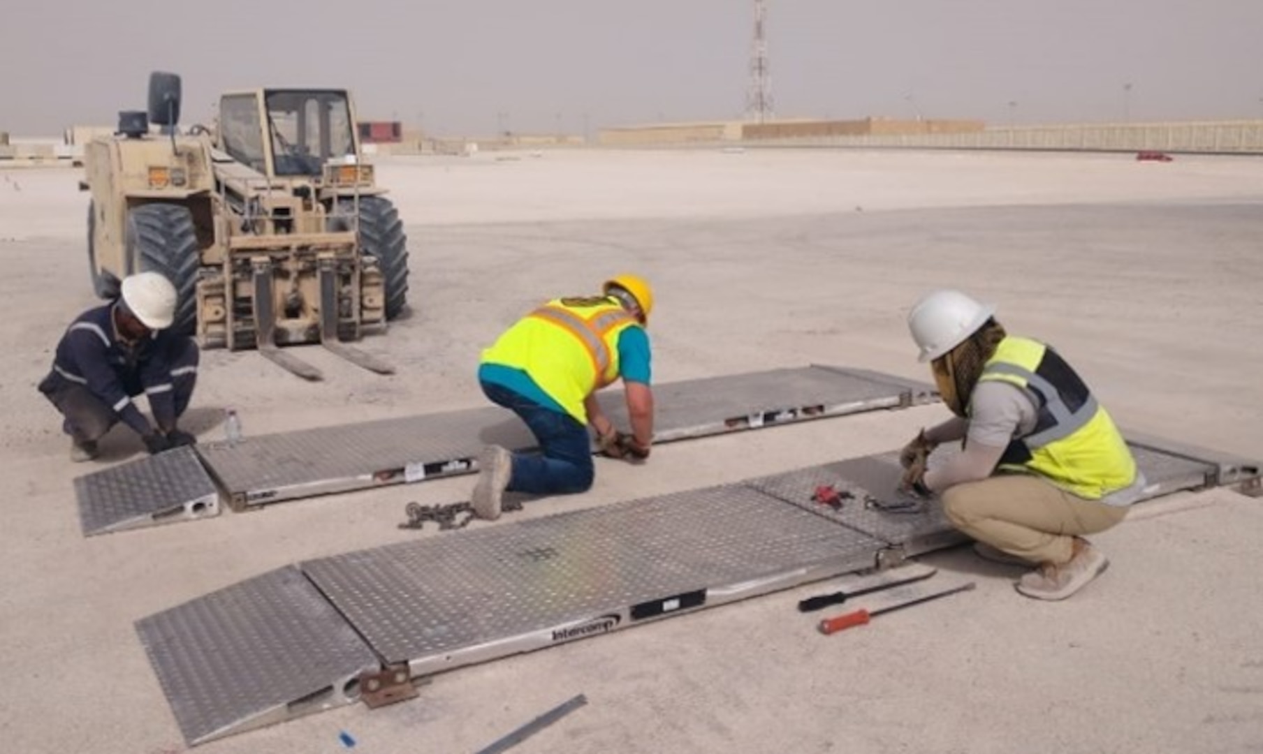 individuals working on portable scales