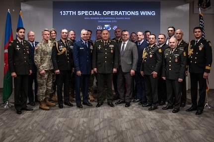 members of a delegation from Azerbaijan pose with Oklahoma National Guardsmen for a photo