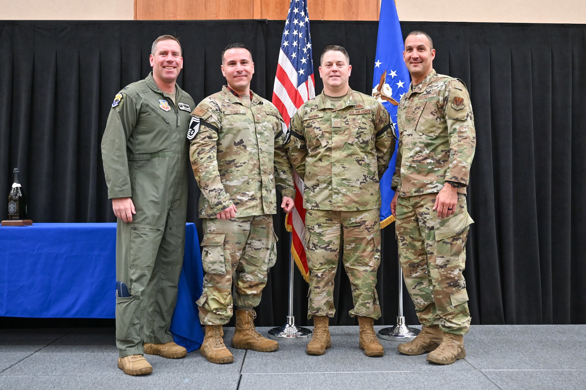 Chief Master Sgt. (select) Christian Suarez, 388th Maintenance Squadron, and Chief Master Sgt. (select) Leondas Moore, 34th Fighter Generation Squadron, pose for a photo with Col. Craig Andrle, 388th FW commander, and Chief Master Sgt. Brandon Wolfgang, 388th FW command chief