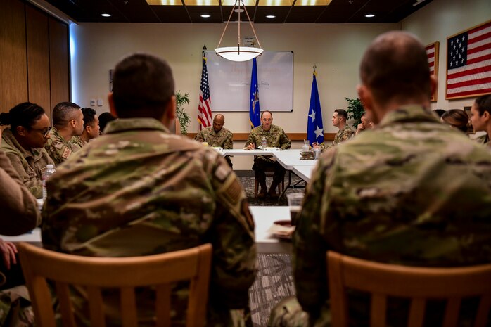 Chief Master Sgt. Kenneth Bruce, 16th Air Force command chief, left and Lt. Gen. Kevin Kennedy, 16th Air Force commander, have lunch with Beale Airmen at Beale Air Force Base, California, Nov. 29, 2022.