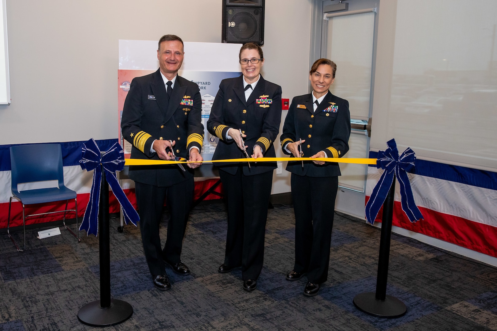 Vice Admiral William Galinis, Commander, Naval Sea Systems Command; Captain Dianna Wolfson, Norfolk Naval Shipyard Commander; and Rear Admiral Maria “Lore” Aguayo, Commander, Naval Facilities Engineering Systems Command Atlantic, cut the ribbon for Norfolk Naval Shipyard’s new Production Training Facility Nov. 30