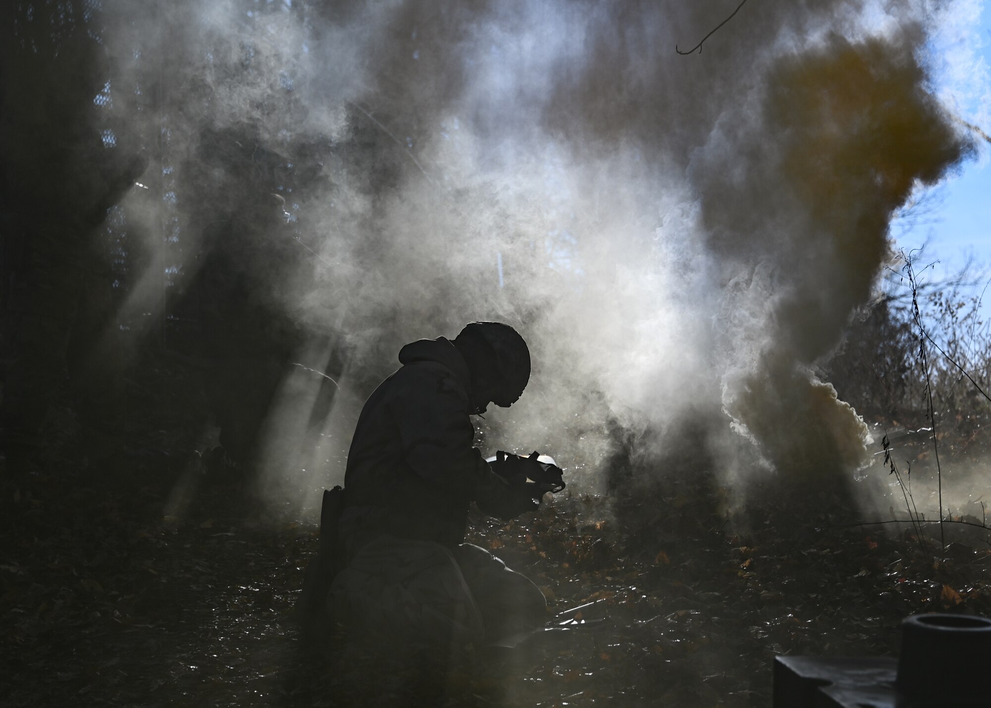 A Joint Base Andrews Airman retrieves a gas mask during a Airman Combat Skills Training exercise at JBA, Md., December 2, 2022. The semi-annual training included a refresher course in Chemical, Biological, Radiological, and Nuclear and Mission-Oriented Protective Posture. (U.S. Air Force photo by Airman 1st Class Isabelle Churchill)