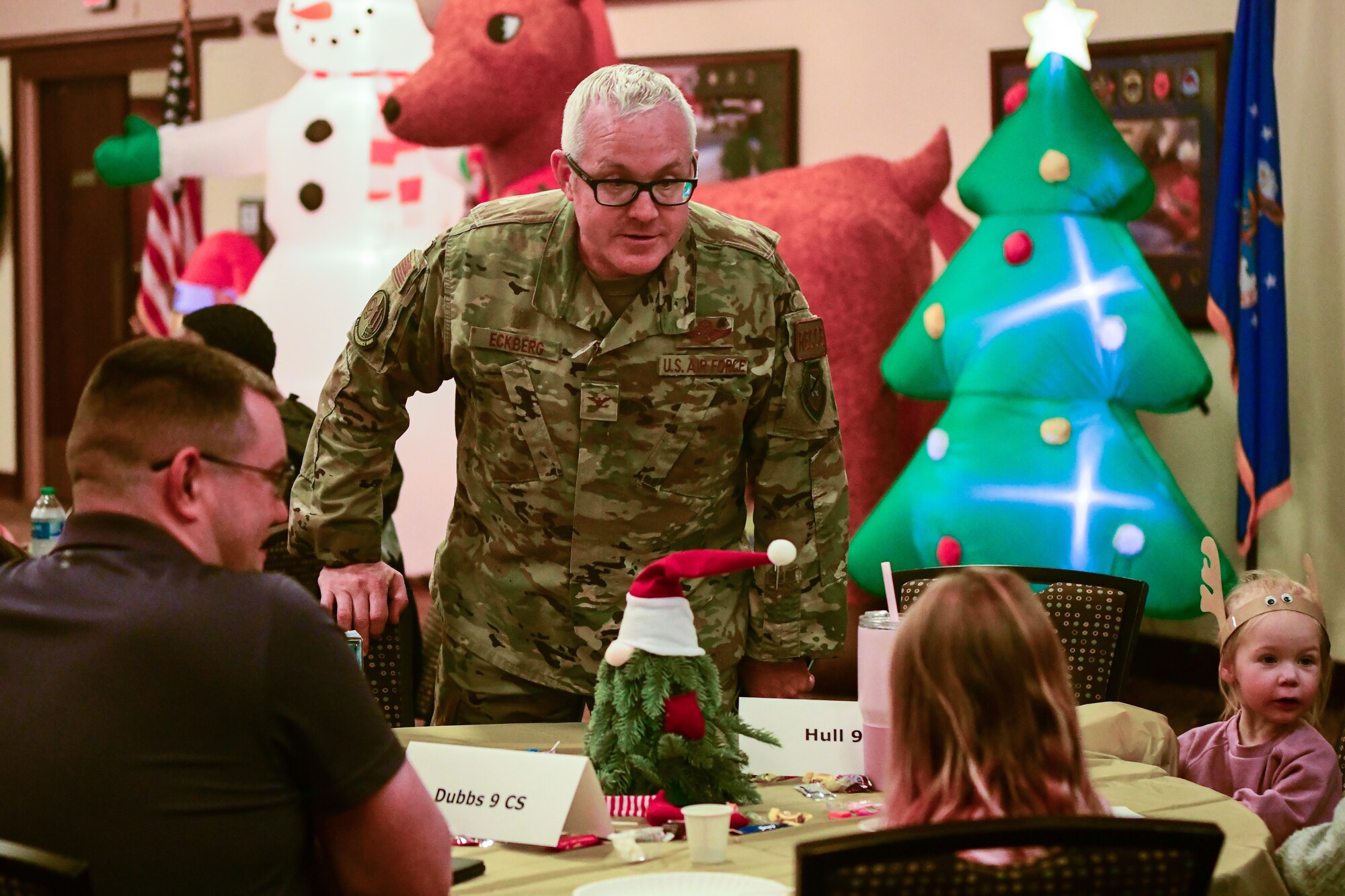 Col. Jason Eckberg, 9th Reconnaissance Wing Vice Commander, talks with people at the Hearts Apart event at the Recce Point Club on Beale Air Force Base, Calif. on Dec. 1, 2022