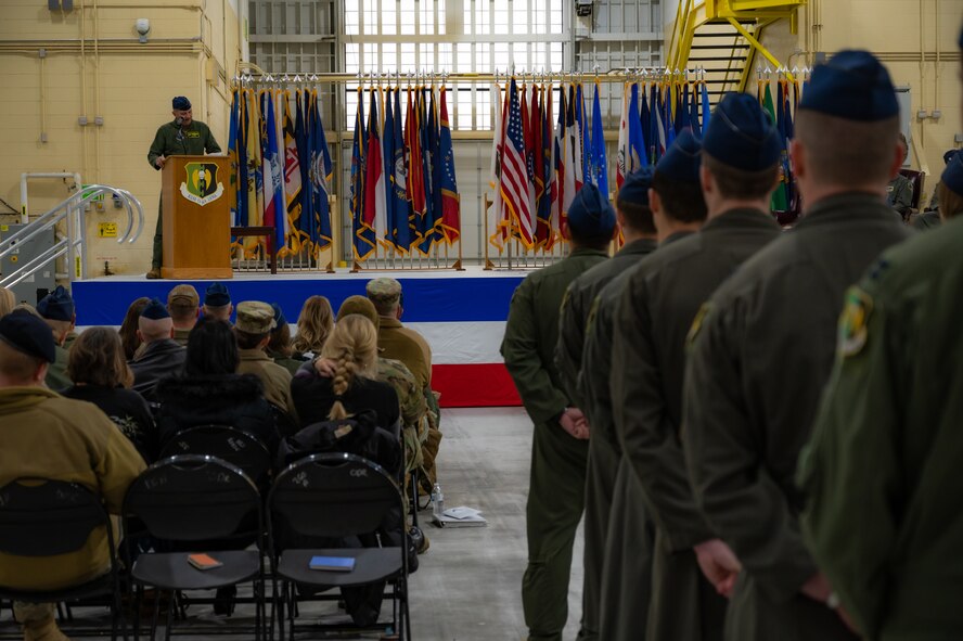 Col. Christopher Cain, 5th Operations Group commander, congratulates the incoming commander at the change of command ceremony at Minot Air Force Base, N.D., Dec. 2, 2022. The lineage of the 69th BS pre-dates World War II, originally titled the 69th Bombardment Squadron, which activated in September of 1941.(U.S. Air Force Photo by Airman 1st Class Alexander Nottingham)