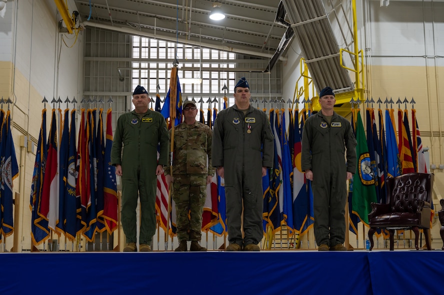 Lt. Col. Brandon Wheeler assumes command of the 69th Bomb Squadron from Lt. Col. Bryson Ayers at Minot Air Force Base, N.D., Dec. 2, 2022. The lineage of the 69th BS pre-dates World War II, originally titled the 69th Bombardment Squadron, which activated in September of 1941.(U.S. Air Force Photo by Airman 1st Class Alexander Nottingham)