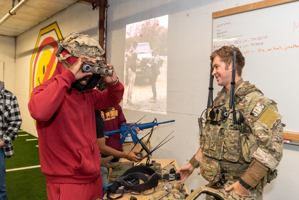 Students exploring tactical gear.