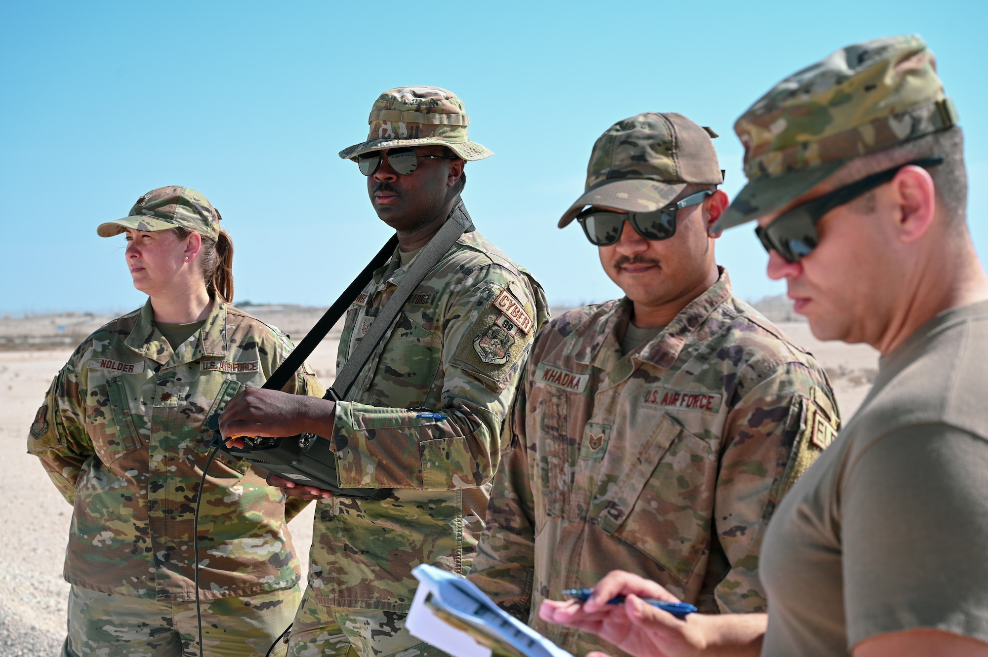 Members of Task Force 99 perform a demo of in-development technologies at Al Udeid Air Base, Qatar, November 18, 2022. Task force 99 is an agile, specialized unit designed to innovate and enhance Ninth Air Force's (Air Forces Central) capabilities within all domains ensuring mission success. (U.S. Air Force photo by Senior Airman Micah Coate)