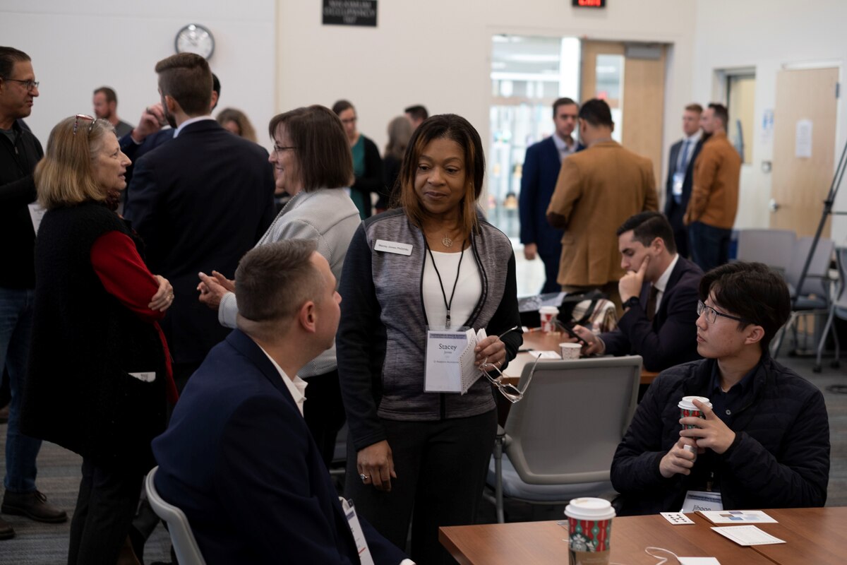 Dr. Stacey Franklin Jones, center, O Analytics founder, senior scientist and head of research, speaks with other attendees at the Air Force Research Laboratory, or AFRL, and Central New Mexico Ingenuity, or CNMI, 2022 Hyperdrive Space Summit in Albuquerque, New Mexico, Nov. 15, 2022. The Hyperdrive Space Summit is an evolution of the Hyperspace Challenge that AFRL’s Technology Outreach Office at Kirtland Air Force Base in New Mexico began in 2018, in partnership with CNMI. More than 150 space technology small businesses, academia, government and others from the space community participated in the event. (Courtesy photo)