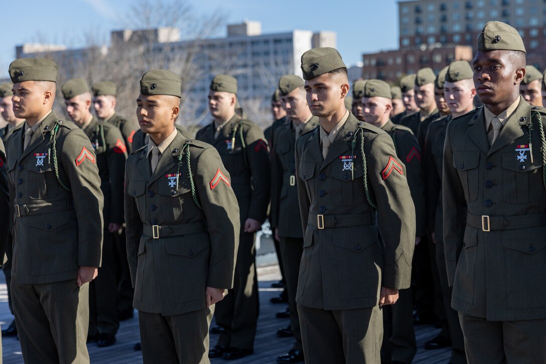 U.S. Marines from 1st Battalion, 8th Marine Regiment, stand at attention during a naturalization ceremony aboard the Battleship USS North Carolina, Dec. 2, 2022. 18 Marines from 15 countries and five continents swore the Oath of Allegiance and received their citizenship. Naturalization is the process by which U.S. citizenship is granted to a foreign citizen after he or she fulfills the requirements to become a citizen established by Congress in the Immigration and Nationality Act of 1965. (U.S. Marine Corps photo by Cpl. Timothy Fowler)