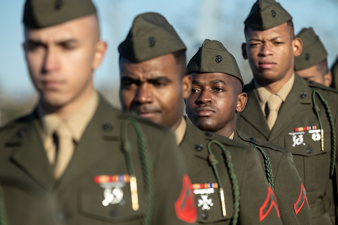 U.S. Marines from 1st Battalion, 8th Marine Regiment, stand at attention during a naturalization ceremony aboard the Battleship USS North Carolina, Dec. 2, 2022. 18 Marines from 15 countries and five continents swore the Oath of Allegiance and received their citizenship. Naturalization is the process by which U.S. citizenship is granted to a foreign citizen after he or she fulfills the requirements to become a citizen established by Congress in the Immigration and Nationality Act of 1965. (U.S. Marine Corps photo by Lance Cpl. Noah Seal)