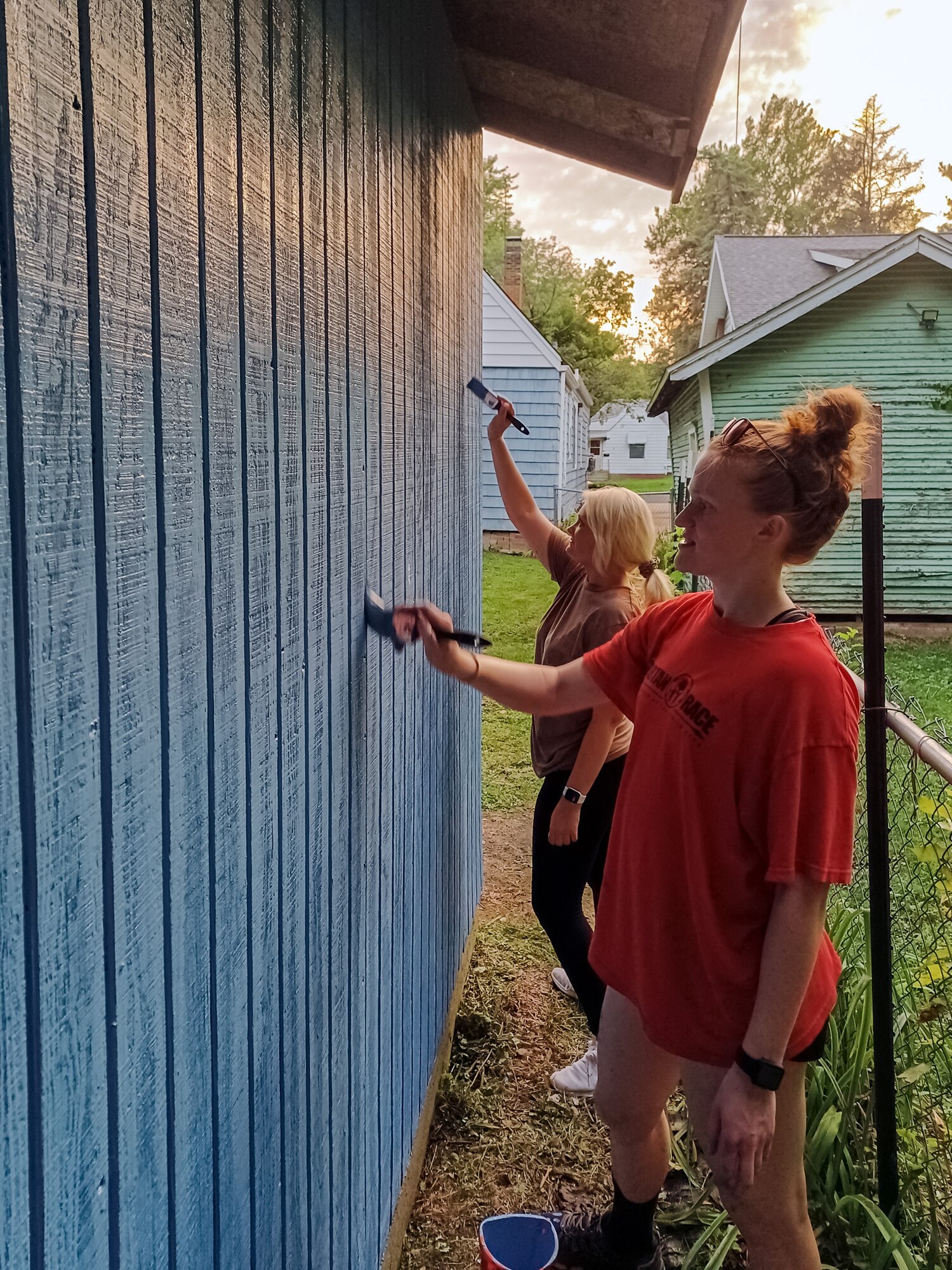 Airmen painting garage.