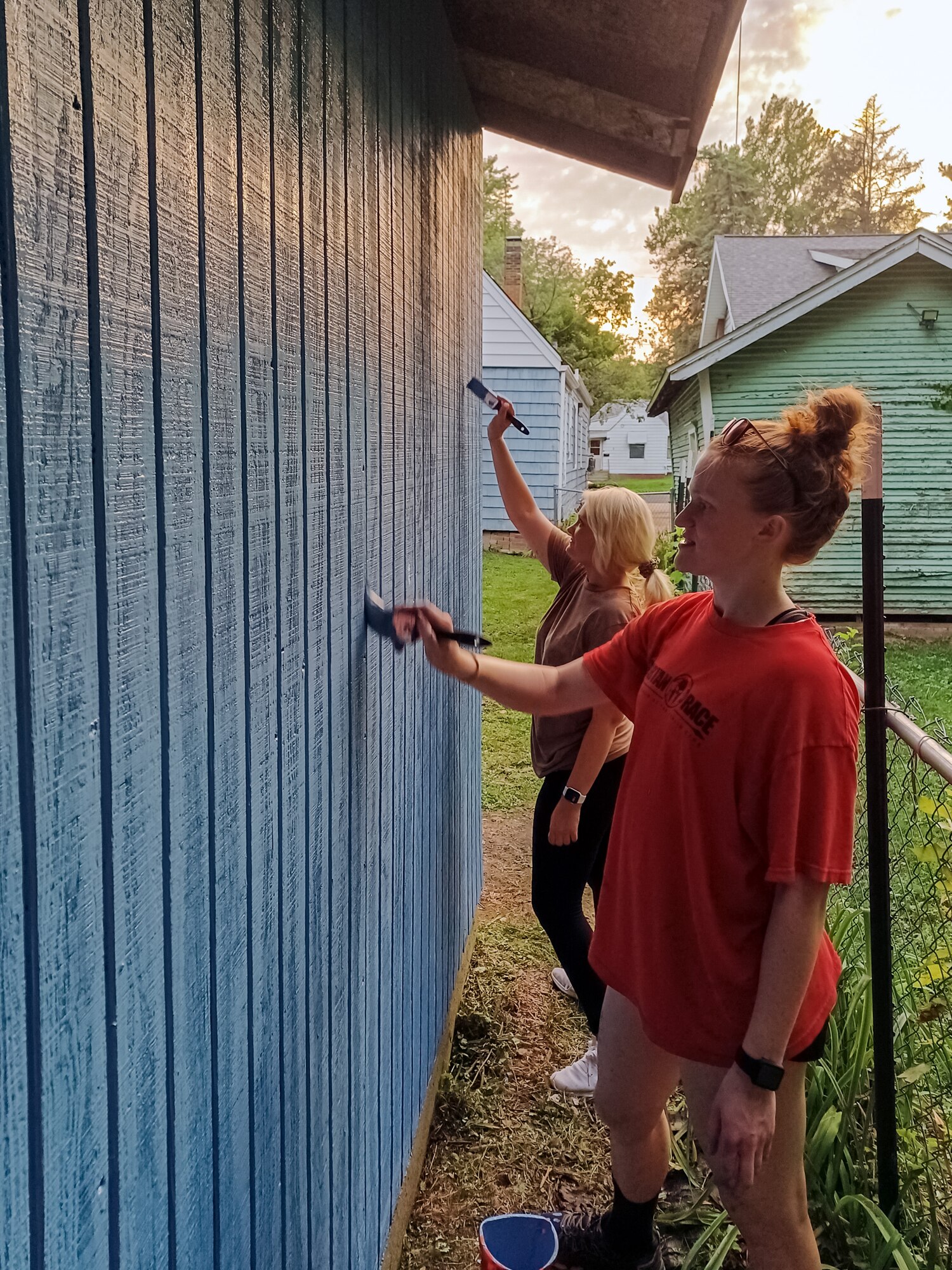 Airmen painting garage.