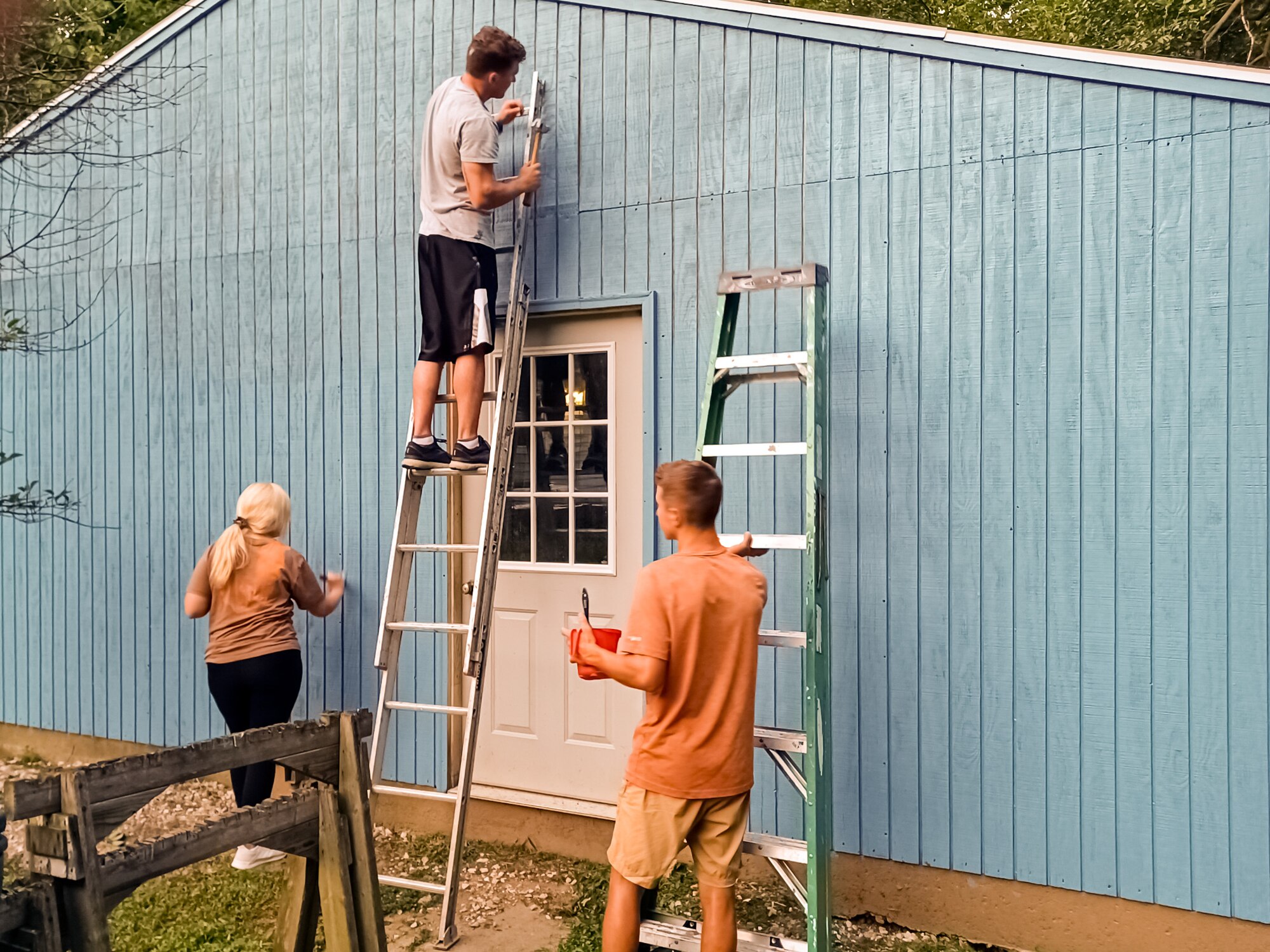 Airmen painting garage.