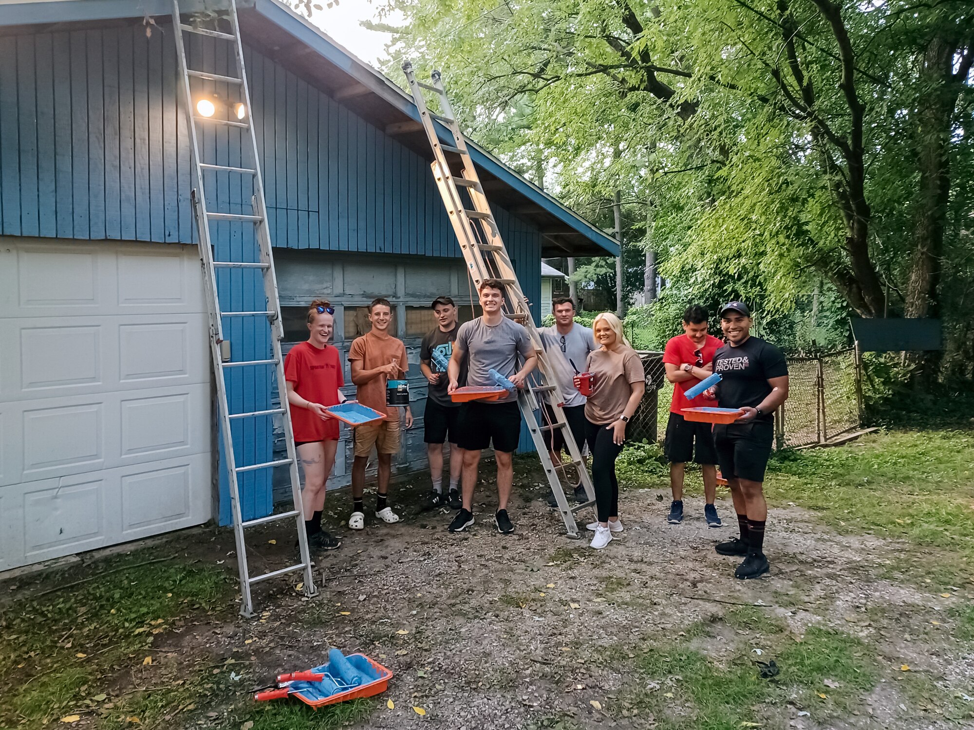 Airmen painting garage.