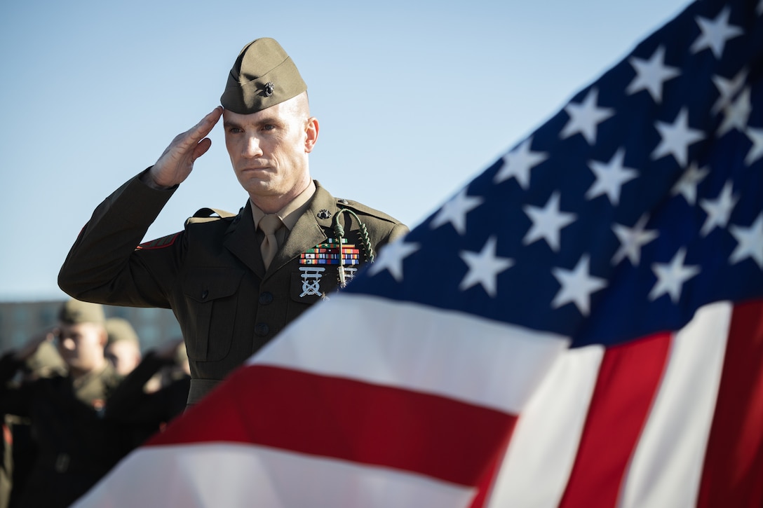 U.S. Marine Corps Sgt. Maj. Daniel Laslett, sergeant major, 1st Battalion, 8th Marine Regiment, salutes during a naturalization ceremony aboard the Battleship USS North Carolina, Dec. 2, 2022. 18 Marines from 15 countries and five continents swore the Oath of Allegiance and received their citizenship. Naturalization is the process by which U.S. citizenship is granted to a foreign citizen after he or she fulfills the requirements to become a citizen established by Congress in the Immigration and Nationality Act of 1965. (U.S. Marine Corps photo by Lance Cpl. Noah Seal)