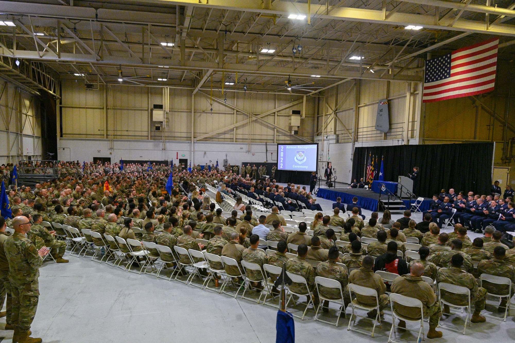 Members from the 175th Wing, Maryland Air National Guard gather in a hangar at Warfield Air National Guard Base, Middle River, Maryland, during the 2022 Airman Recognition Ceremony, December 4, 2022.