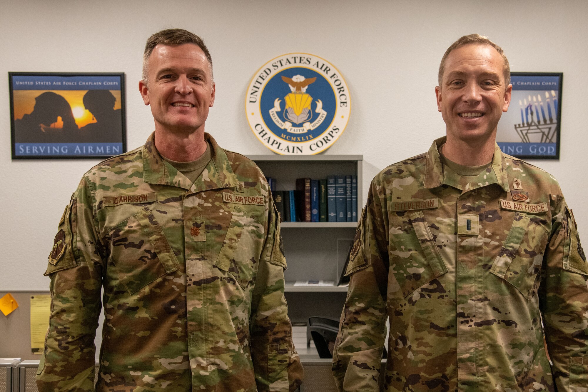 Chaplain Garrison and Chaplain Steverson stand in front of their office