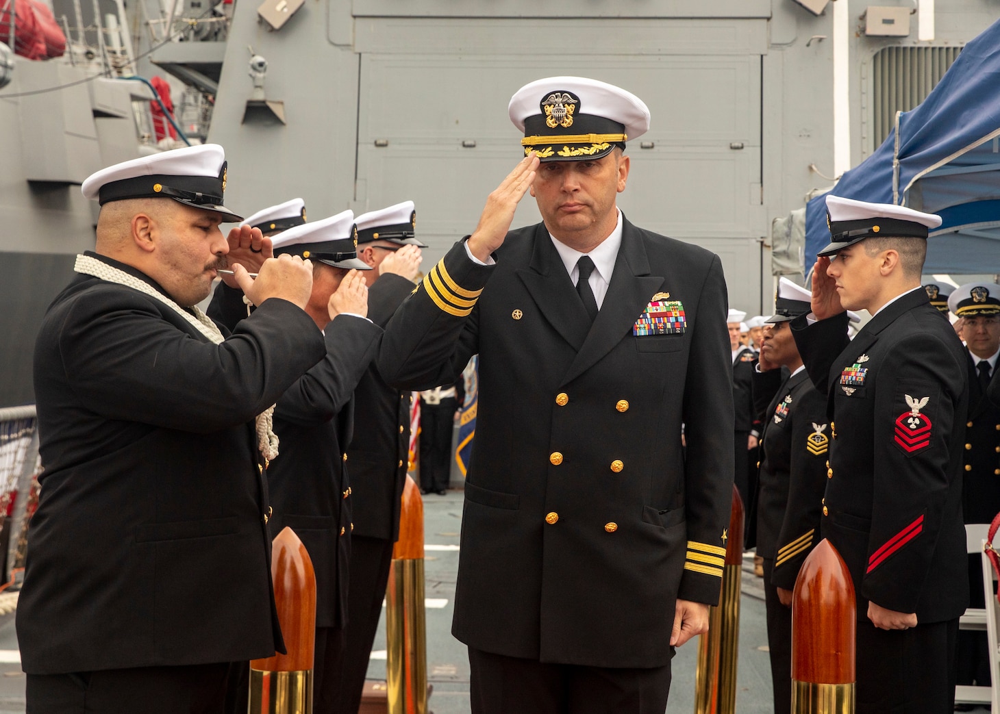 YOKOSUKA, Japan (Dec. 1, 2022) Cmdr. Travis Montplaisir, outgoing commanding officer of Arleigh Burke-class guided-missile destroyer USS Howard (DDG 83), salutes as he walks through sideboys during a change of command ceremony aboard the ship, forward-deployed to Commander, Fleet Activities Yokosuka, Dec. 1. Howard is assigned to Commander, Task Force 71/ Destroyer Squadron (DESRON) 15, the Navy’s largest forward-deployed DESRON and the U.S. 7th fleet’s principal surface force. (U.S. Navy photo by Mass Communication Specialist 2nd Class Samantha Oblander)