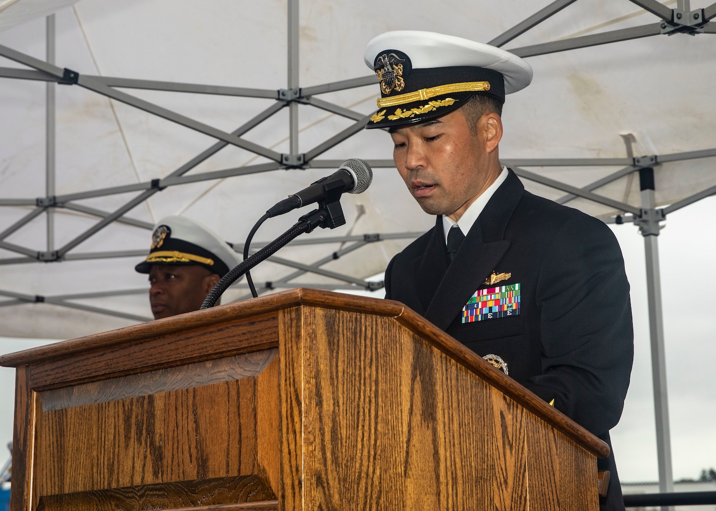 YOKOSUKA, Japan (Dec. 1, 2022) Cmdr. Kenji Igawa, incoming commanding officer of Arleigh Burke-class guided-missile destroyer USS Howard (DDG 83), reads his orders during a change of command ceremony aboard the ship, forward-deployed to Commander, Fleet Activities Yokosuka, Dec. 1. Howard is assigned to Commander, Task Force 71/Destroyer Squadron (DESRON) 15, the Navy’s largest forward-deployed DESRON and the U.S. 7th fleet’s principal surface force. (U.S. Navy photo by Mass Communication Specialist 2nd Class Samantha Oblander)
