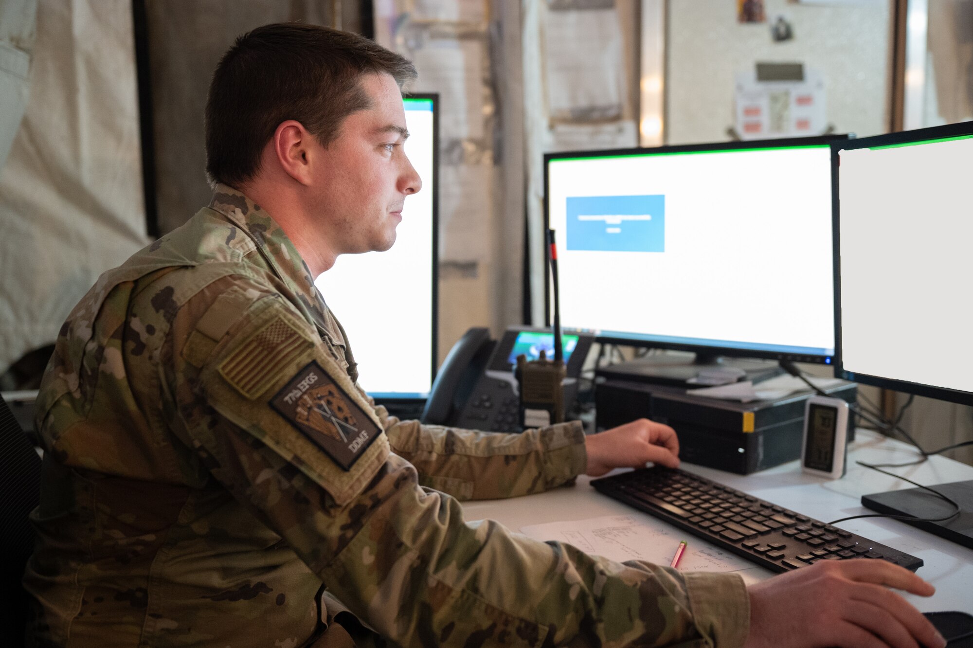 U.S. Air Force Senior Airman Mark Demers, a 77th Expeditionary Fighter Generation Squadron debrief technician, reviews data inputs, Nov. 8, 2022, at Prince Sultan Air Base, Kingdom of Saudi Arabia.