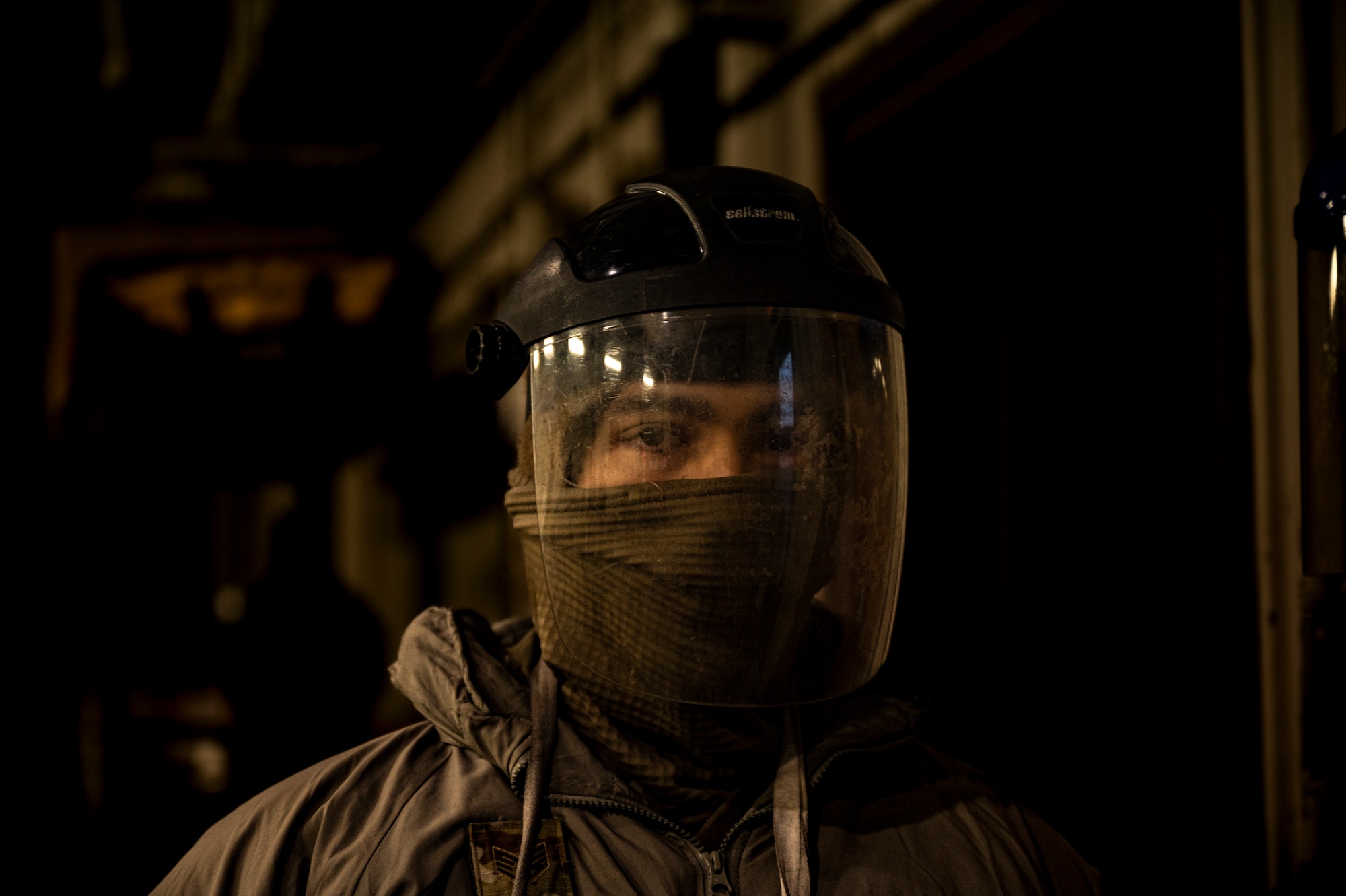 U.S. Air Force Staff Sgt. Zachary Smith, 51st Logistics Readiness Squadron fuels distribution supervisor dons protective gear before performing morning checkpoint inspections at Osan Air Base, Republic of Korea, Dec. 1, 2022.