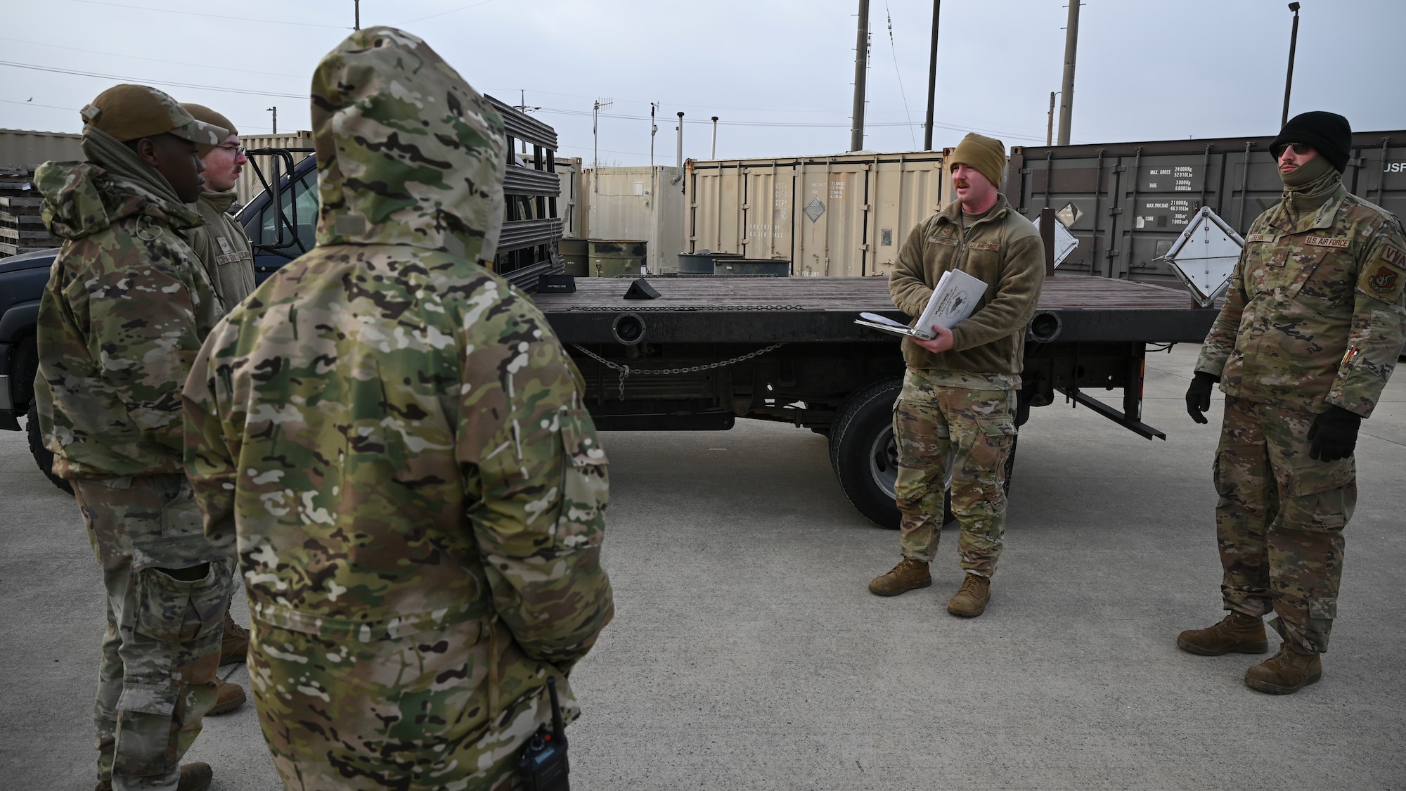 An Airman performs a safety brief to his fellow Airmen