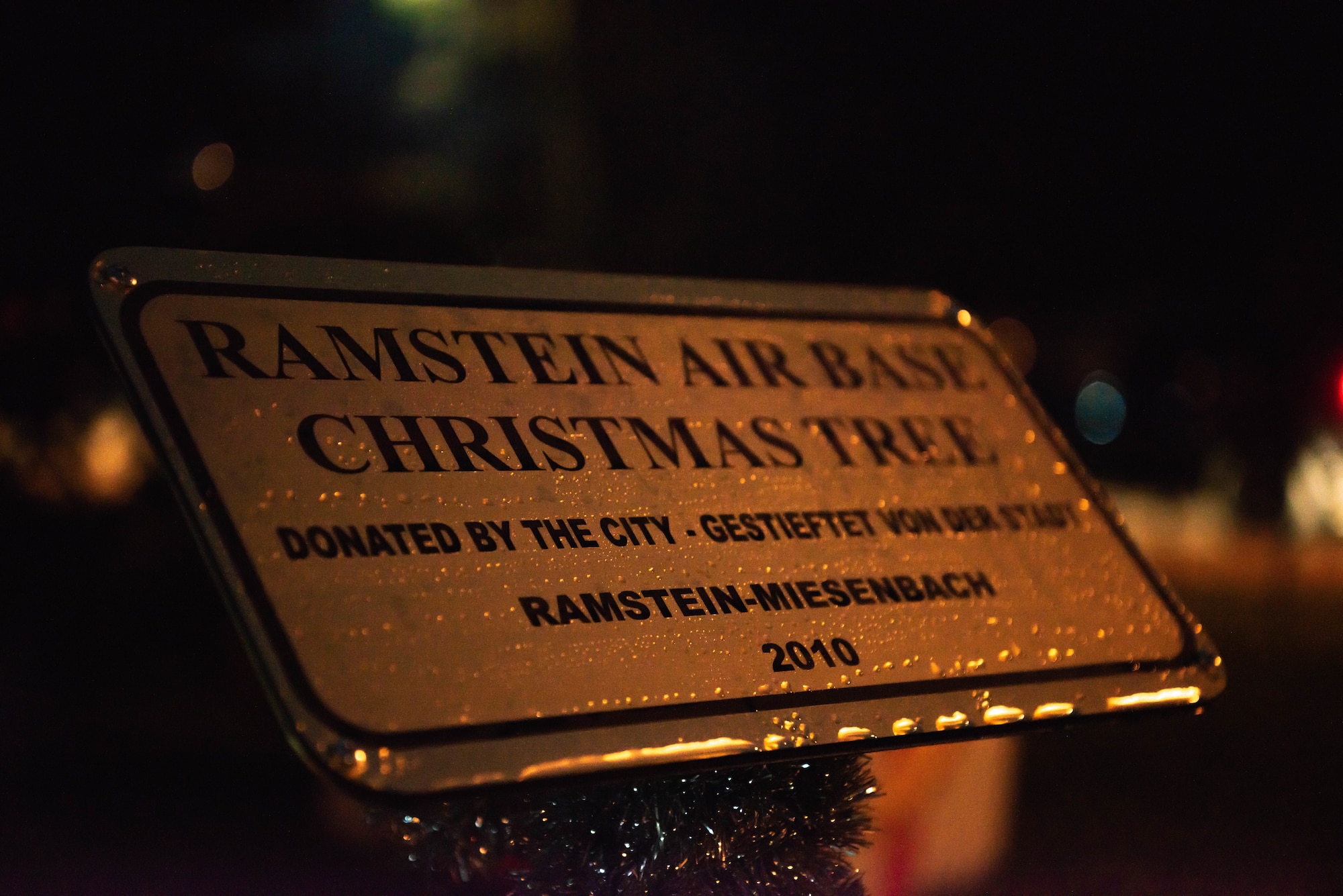 Sign stands in front of a tree
