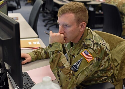 U.S. Space Force Specialist 2 Jake Corino, 315th Training Squadron student, concentrates during the Operation Lone Star capstone at Goodfellow Air Force Base, Texas, Nov. 28, 2022. The Operation Lone Star capstone is the first time during technical training that all four intelligence career fields under the 315th TRS collaborate in a simulated combat environment. (U.S. Air Force photo by Airman 1st Class Sarah Williams)