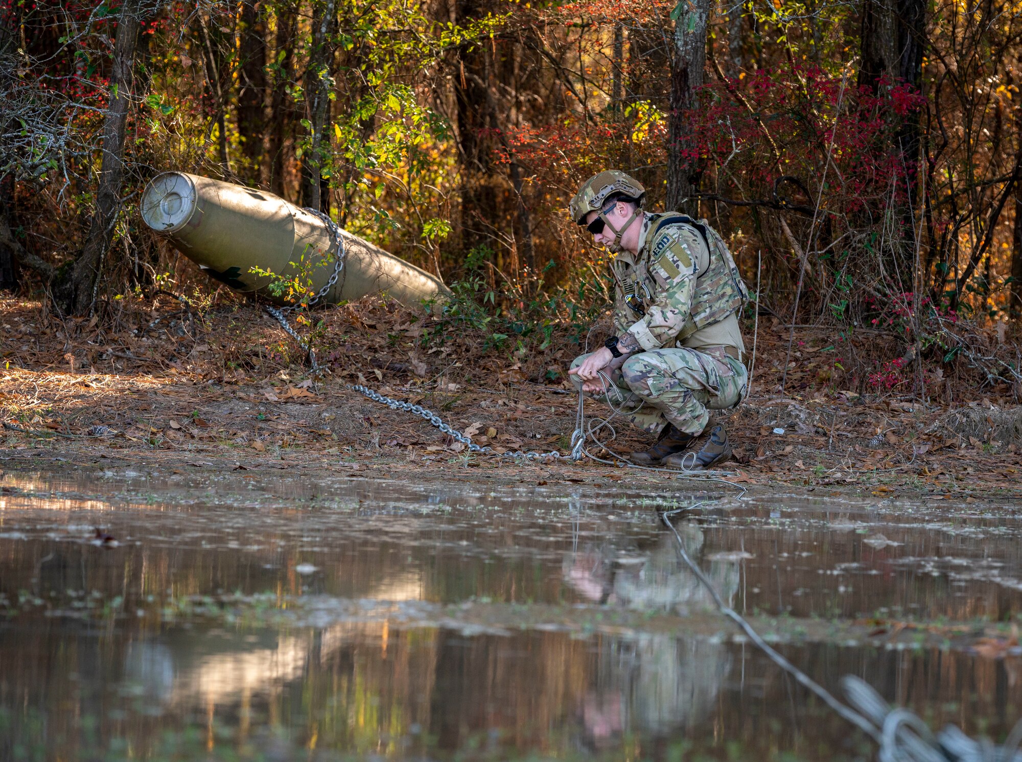 Senior Airman Nicholas Farrar, 4th Civil Engineer Squadron explosive ordnance disposal apprentice, prepares to move inert explosives to a safe area during EOD training, at Seymour Johnson Air Force Base, North Carolina, Dec. 1, 2022. EOD Airmen identify and assess ordnance conditions and advise commanders on recommended safe withdrawal distances. (U.S. Air Force photo by Airman 1st Class Sabrina Fuller)