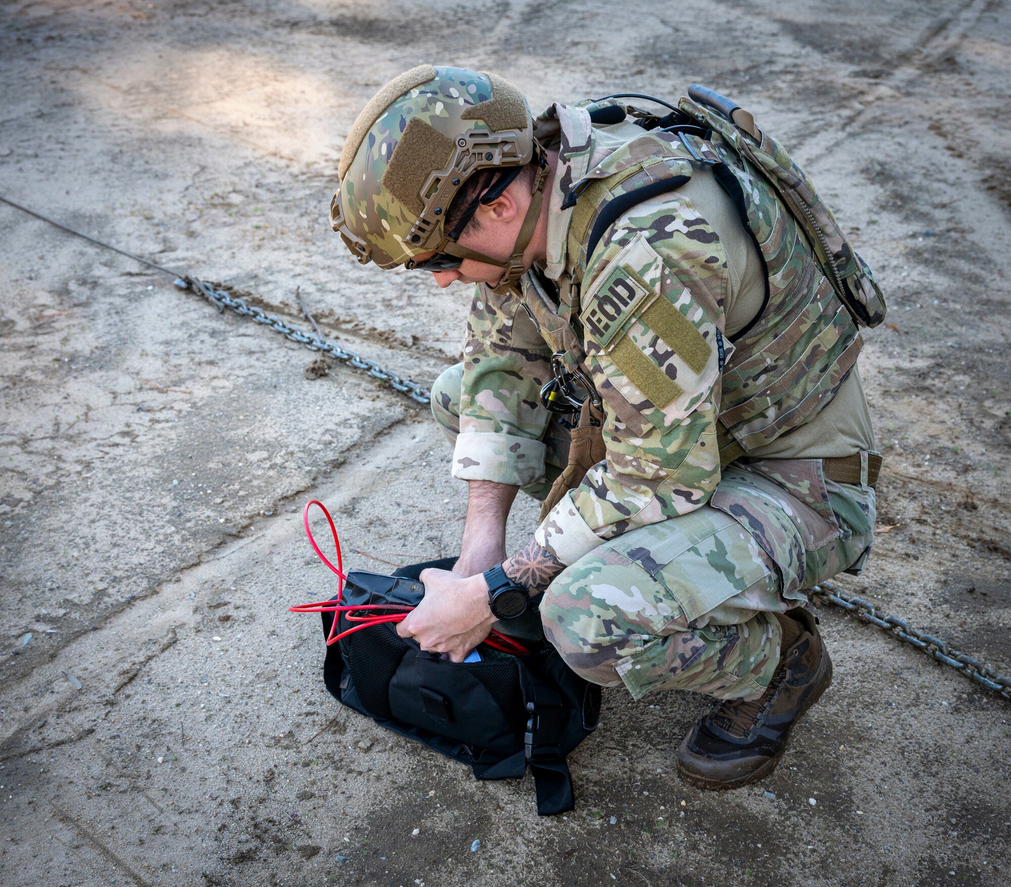 Senior Airman Nicholas Farrar, 4th Civil Engineer Squadron explosive ordnance disposal apprentice, prepares to mount a Demolition M112 onto an inert explosive during EOD training at Seymour Johnson Air Force Base, North Carolina, Dec. 1, 2022.  The 4th CES EOD unit instructs base and community members on ordnance recognition and protective measures for improvised explosive devices and conventional ordnance. (U.S. Air Force photo by Airman 1st Class Sabrina Fuller)