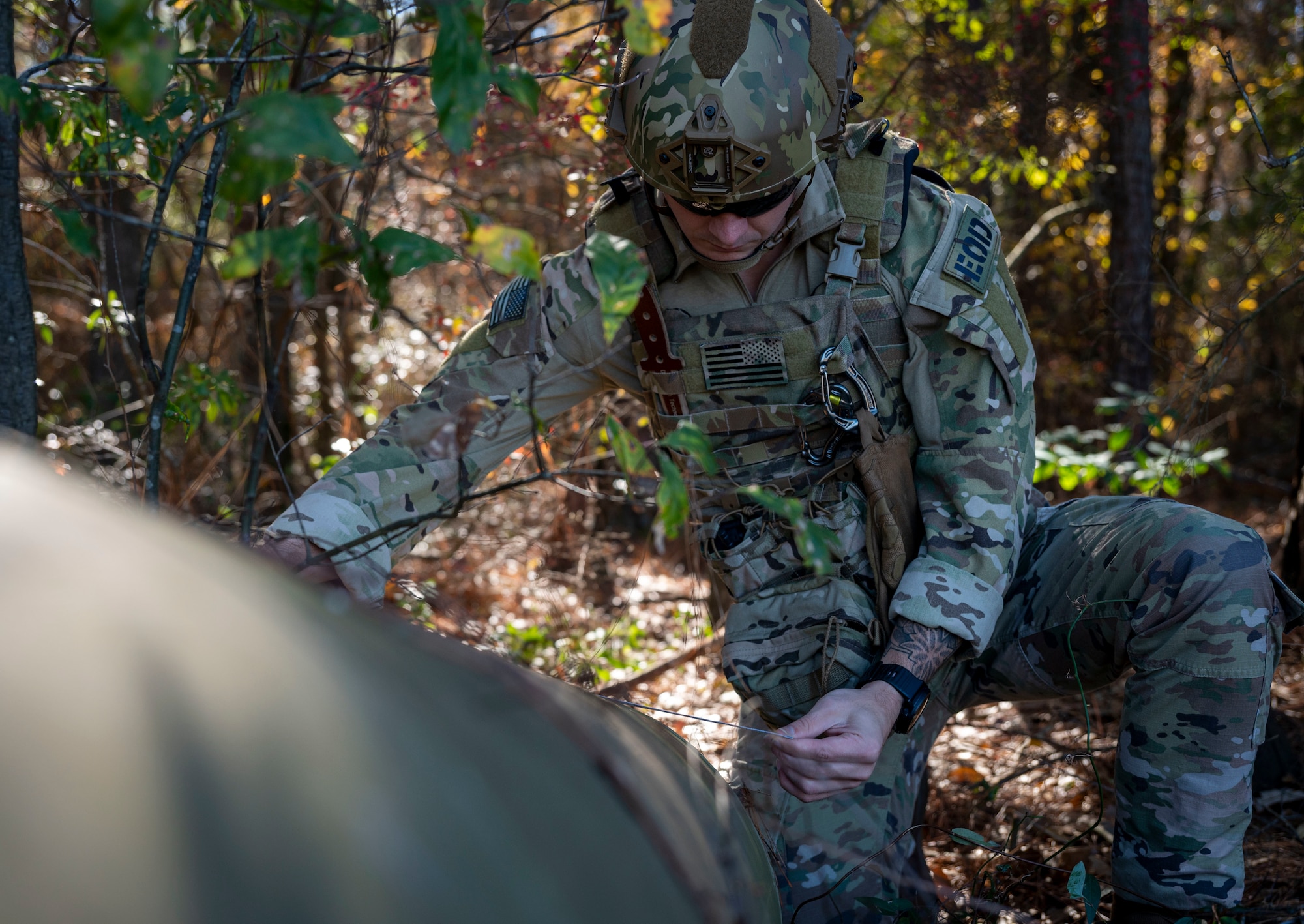 Senior Airman Nicholas Farrar, 4th Civil Engineer Squadron explosive ordnance disposal apprentice, inspects inert explosives during EOD training at Seymour Johnson Air Force Base, North Carolina, Dec. 1, 2022. EOD teams are dispatched to neutralize highly dangerous materials after a safe perimeter has been established around a device. (U.S. Air Force photo by Airman 1st Class Sabrina Fuller)