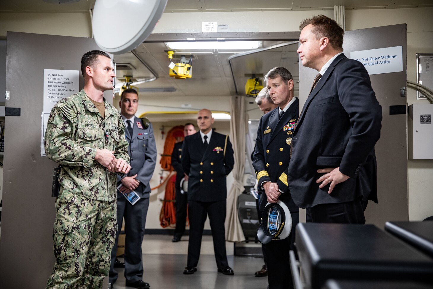 U.S. Navy Hospital Corpsman 2nd Class Mason Hedeen, left, assigned to the San Antonio-class amphibious transport dock ship USS Arlington (LPD 24), gives the Honorable Antti Kaikkonen, right, Finnish Minister of Defense, a tour of Arlington’s medical facilities at Naval Station Norfolk, Virginia, Dec. 4, 2022.