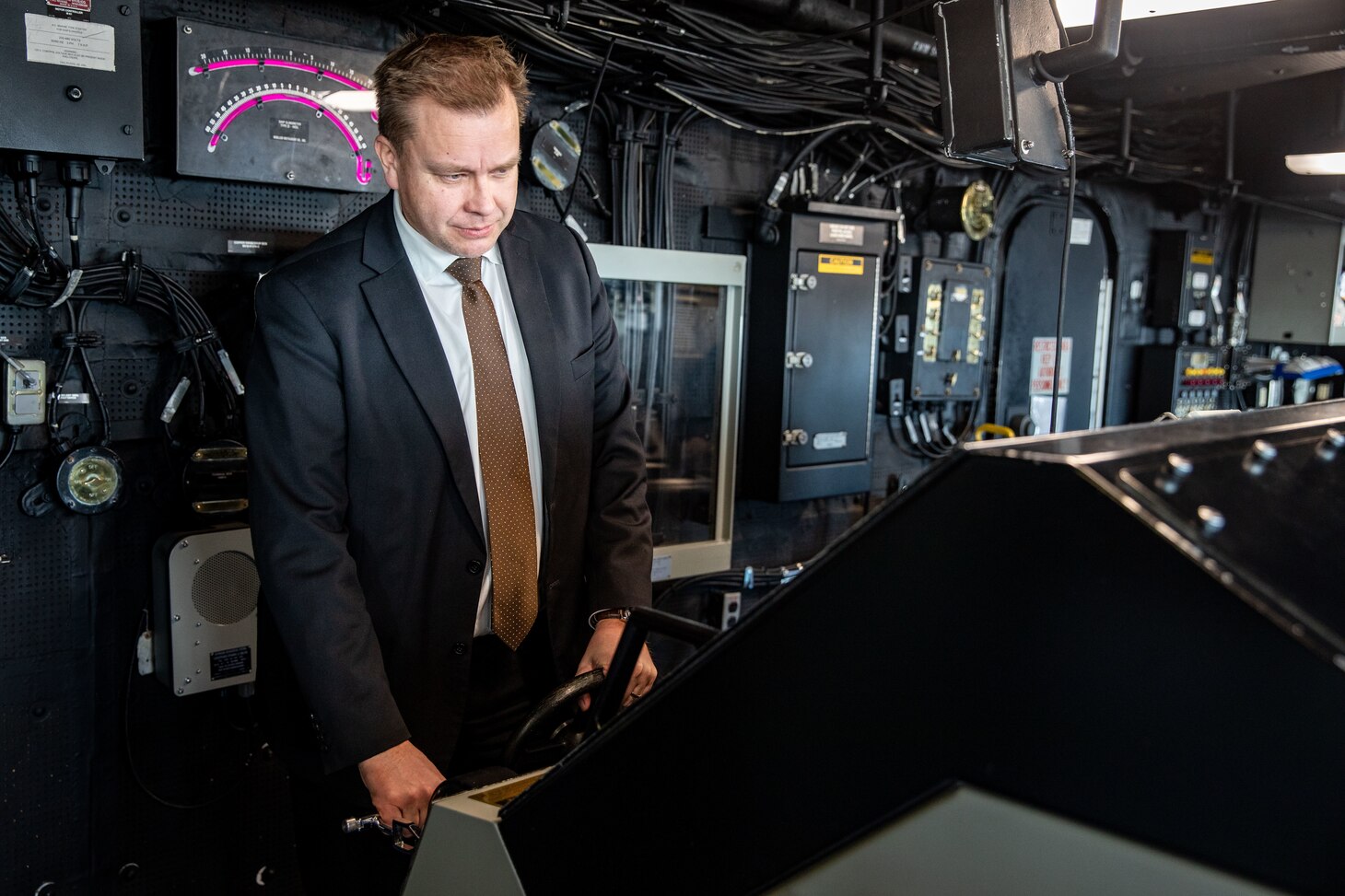 The Honorable Antti Kaikkonen, Finnish Minister of Defense, tours the pilot house aboard the San Antonio-class amphibious transport dock ship USS Arlington (LPD 24) at Naval Station Norfolk, Virginia, Dec. 4, 2022.