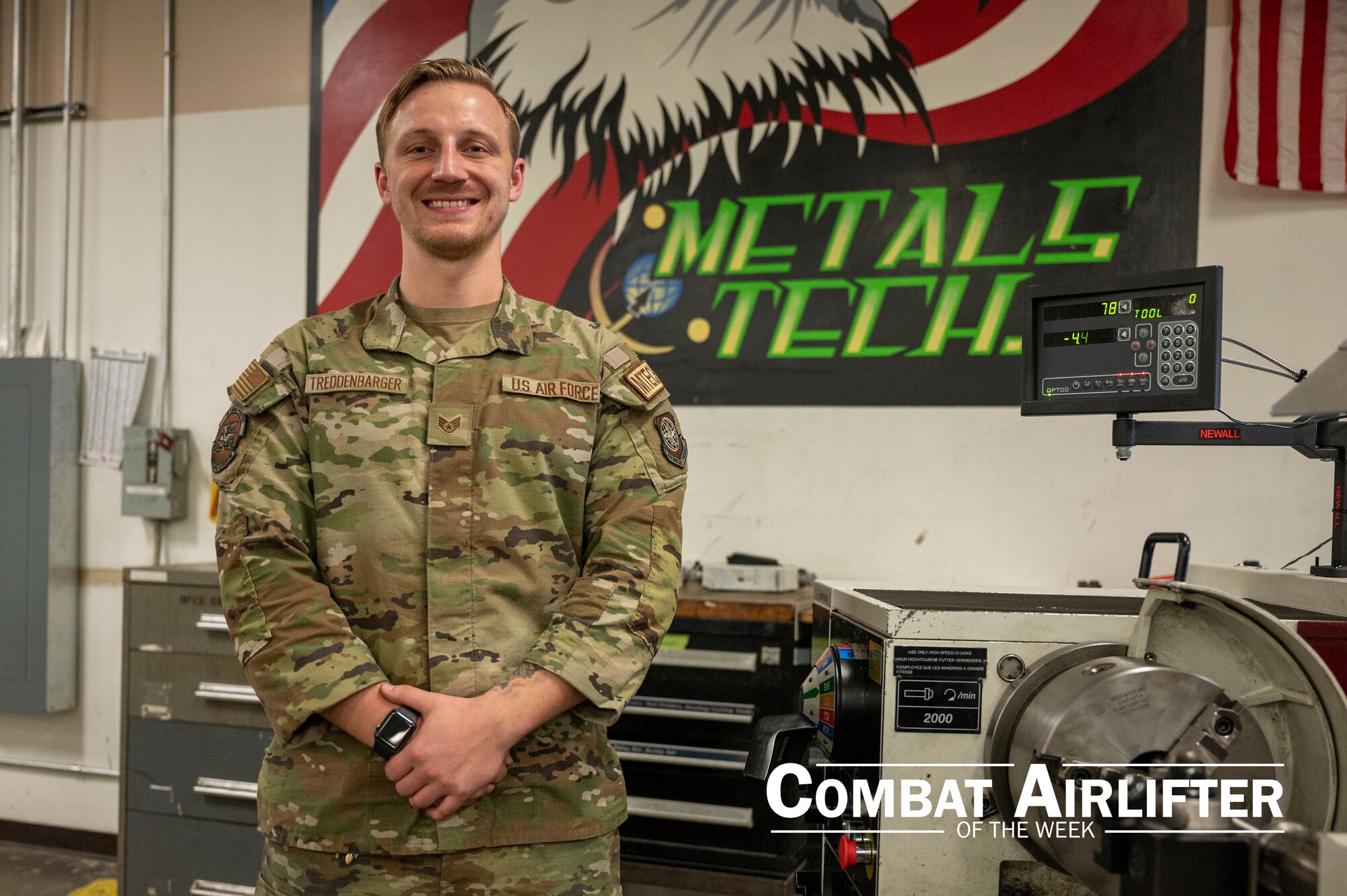A man in uniform poses for a photo