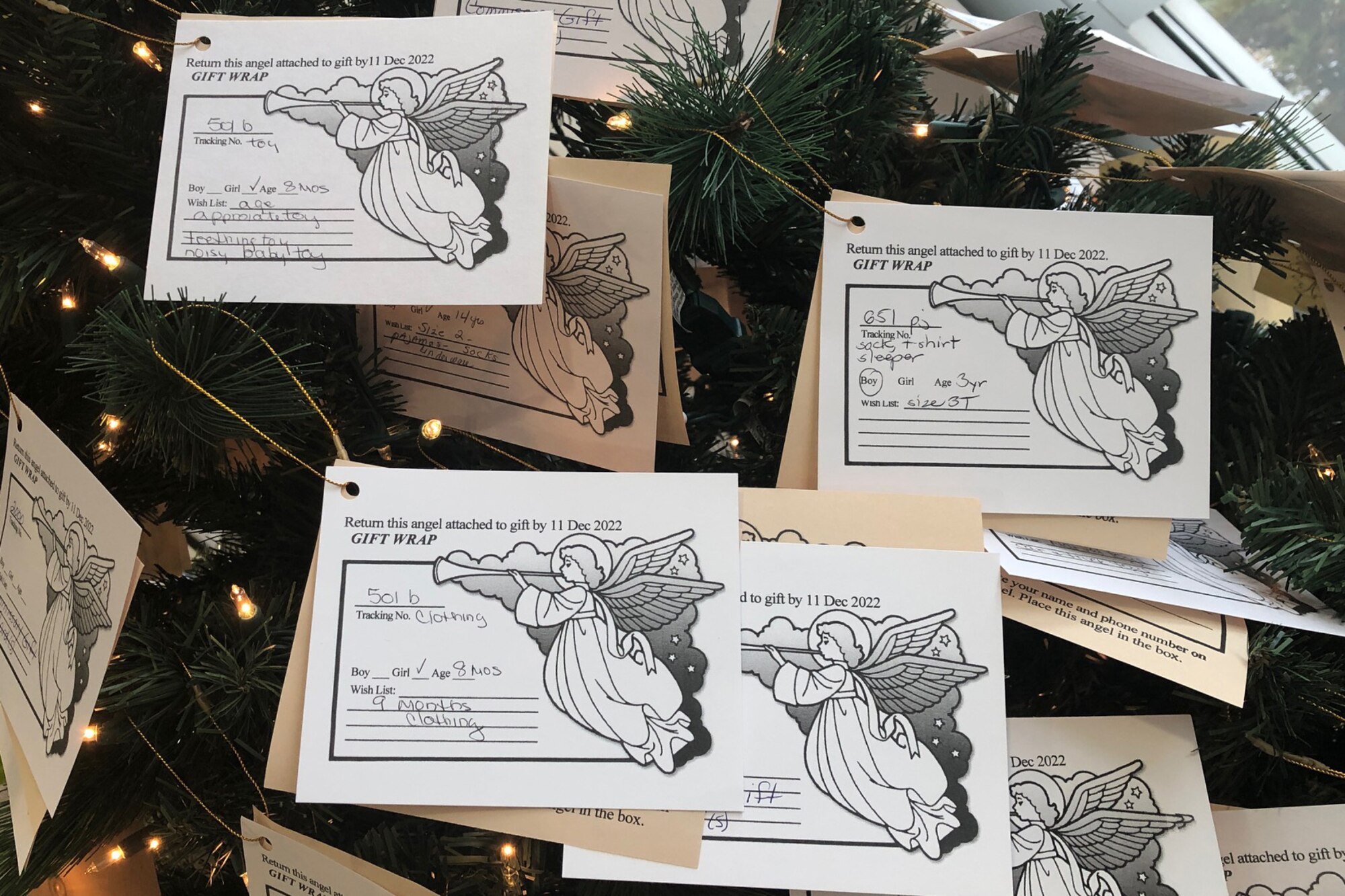 Angel cards hang on a Christmas Tree