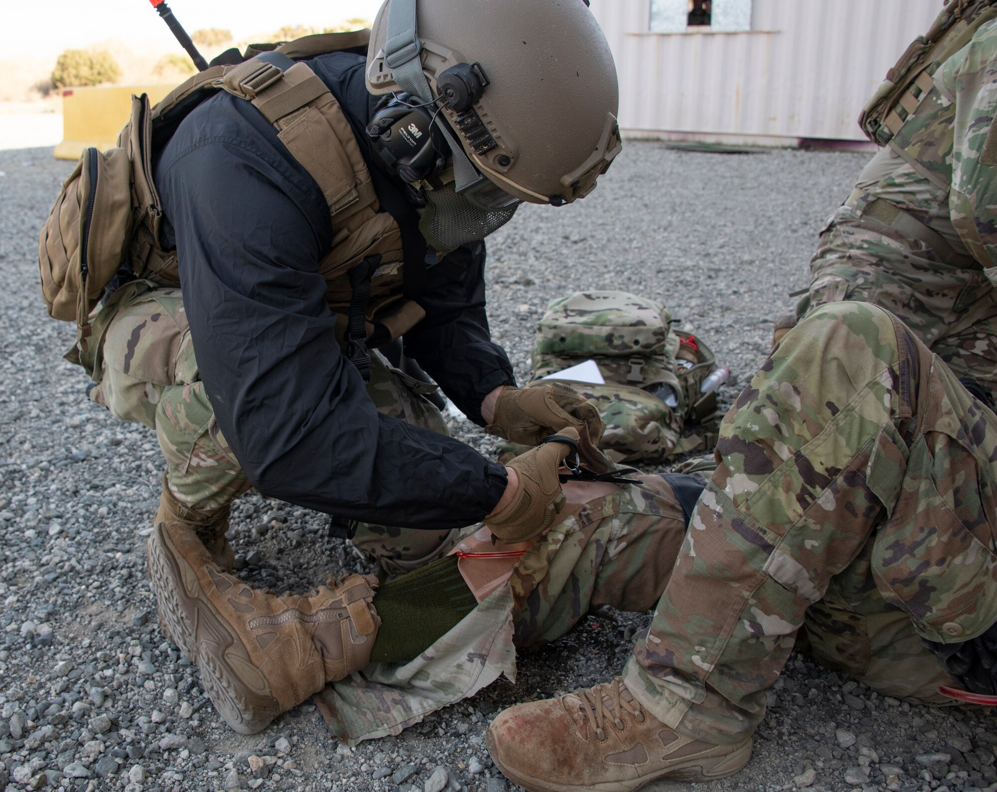 Airman attends to simulated victim.