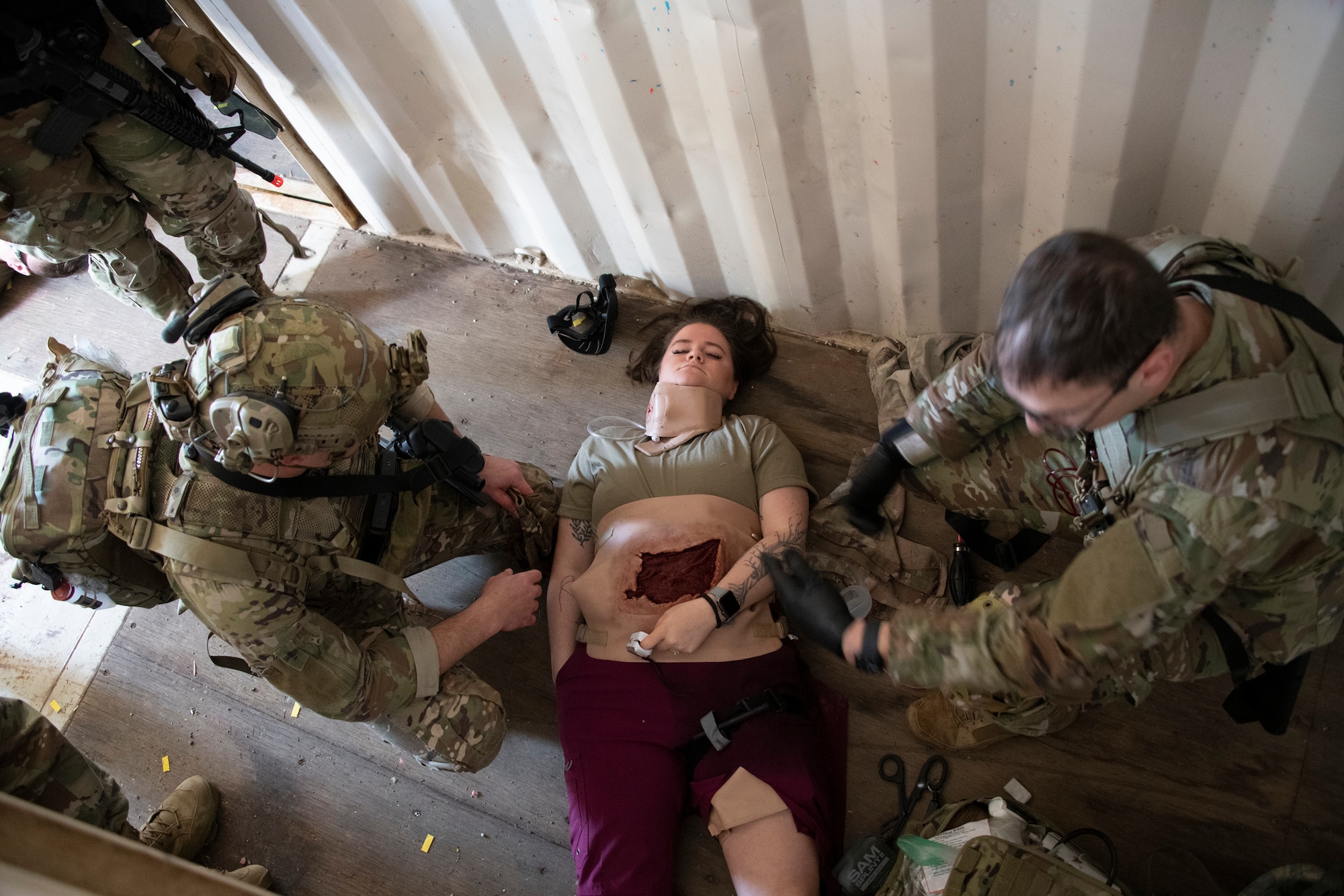Airman attend to simulated wounded.