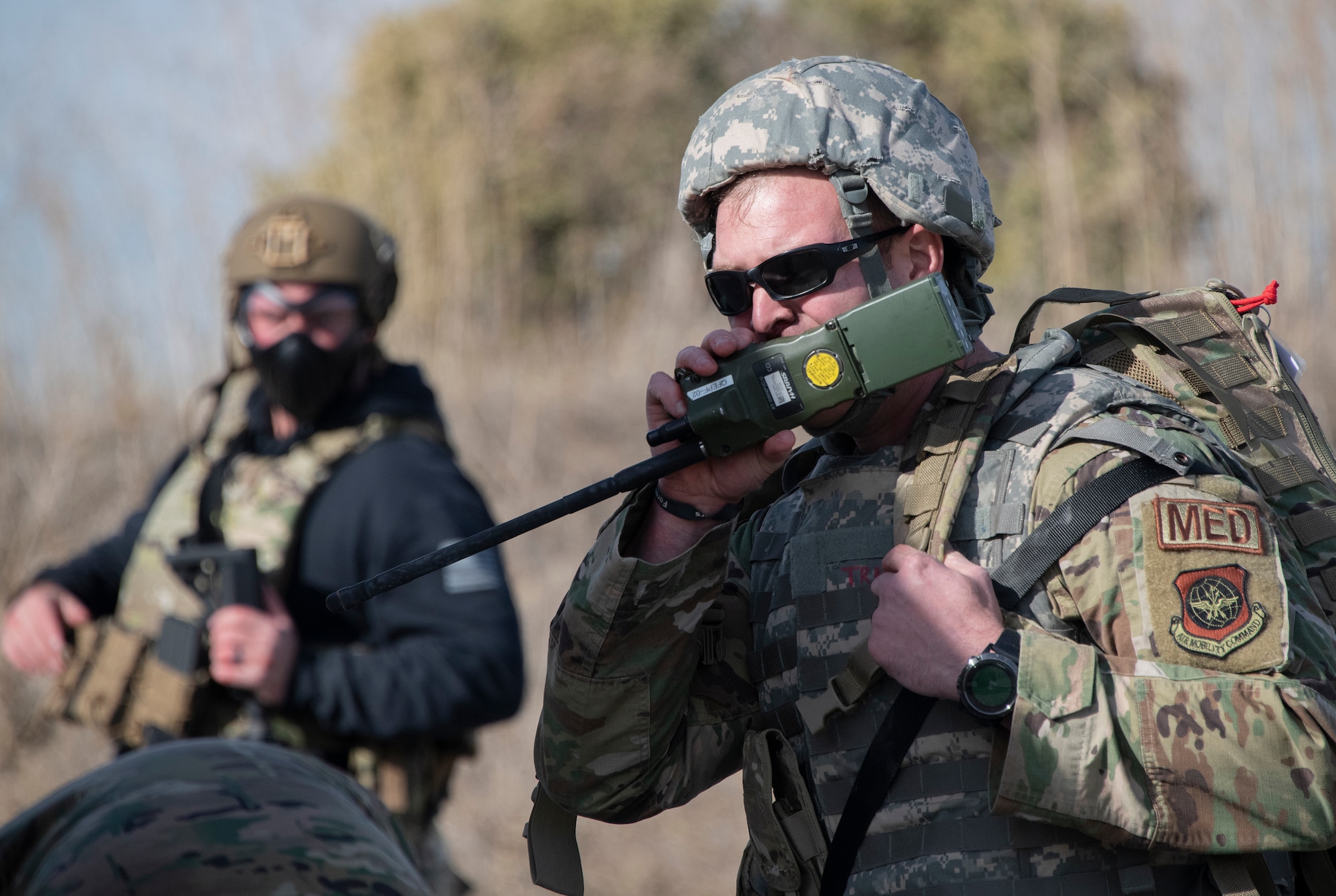 Airman talking on radio.