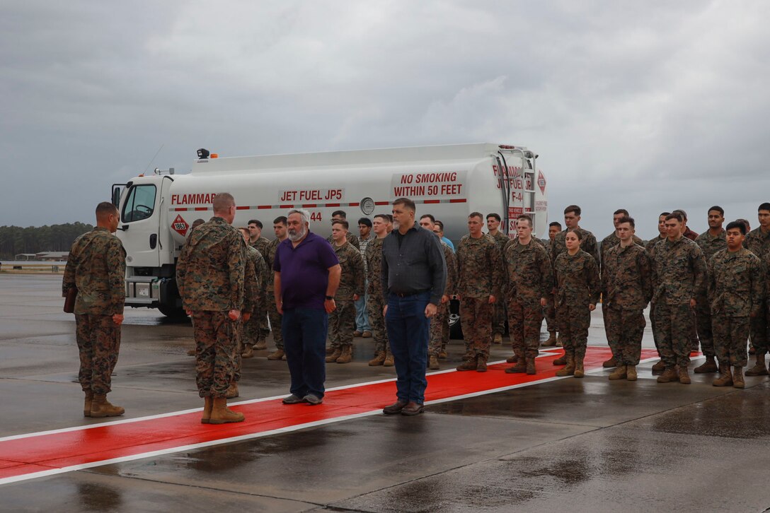 U.S. Marine Corps Lt. Gen. Edward Banta, right, Deputy Commandant of Installations and Logistics, and Marine Corps Air Station (MCAS) Cherry Point’s Sergeant Major, Sgt. Maj. James Robertson, left, present awards to the MCAS Cherry Point Fuels Department personnel at MCAS Cherry Point, North Carolina, Nov. 30, 2022. This year the MCAS Cherry Point Fuels Department received three awards from the Naval Petroleum Office for its outstanding performance. Lt. Gen. Banta traveled to Cherry Point to personally recognize the award recipients and the fuel department for being named the Marine Corps Outstanding Fuels Facility of the Year, as well as the outstanding fuels civilian and Marine of the year. (U.S. Marine Corps photo by Lance Cpl. Jade Farrington)
